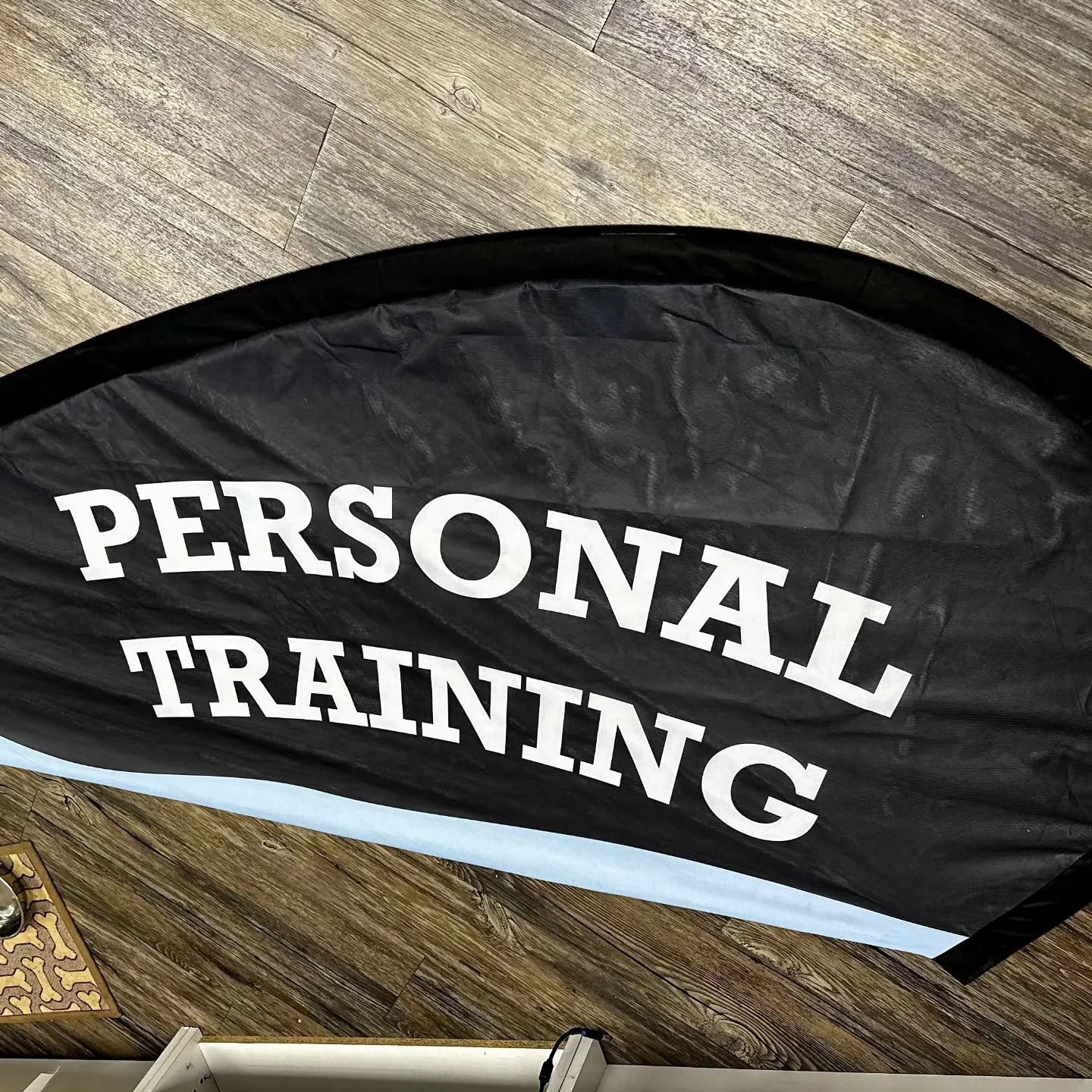 This is a mini version of a flag that's being put up. Did they say two flags, 18 feet long? 
Well, sign up for personal training: virtual, in-home! Prices reduced on our best-selling packages by $150! Contact us here or through our website in our bio