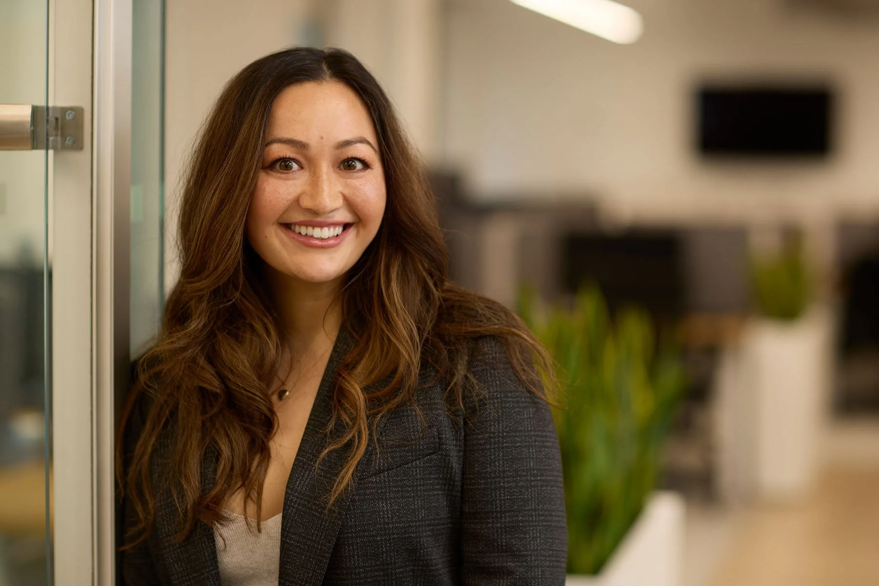 Professional corporate portrait of an executive in NYC office setting
