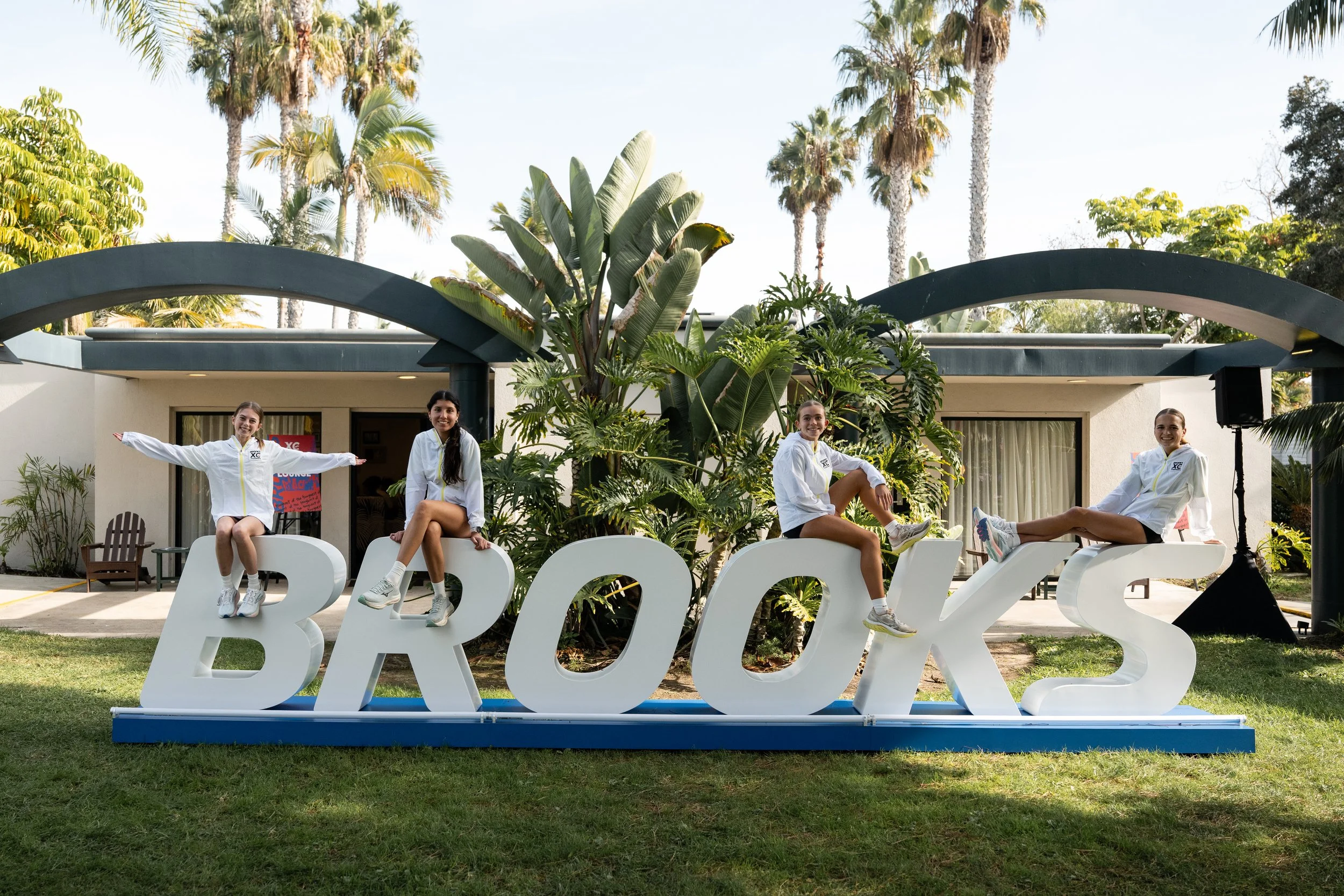 Athletes on the Brooks sign at the Brooks XC Championships