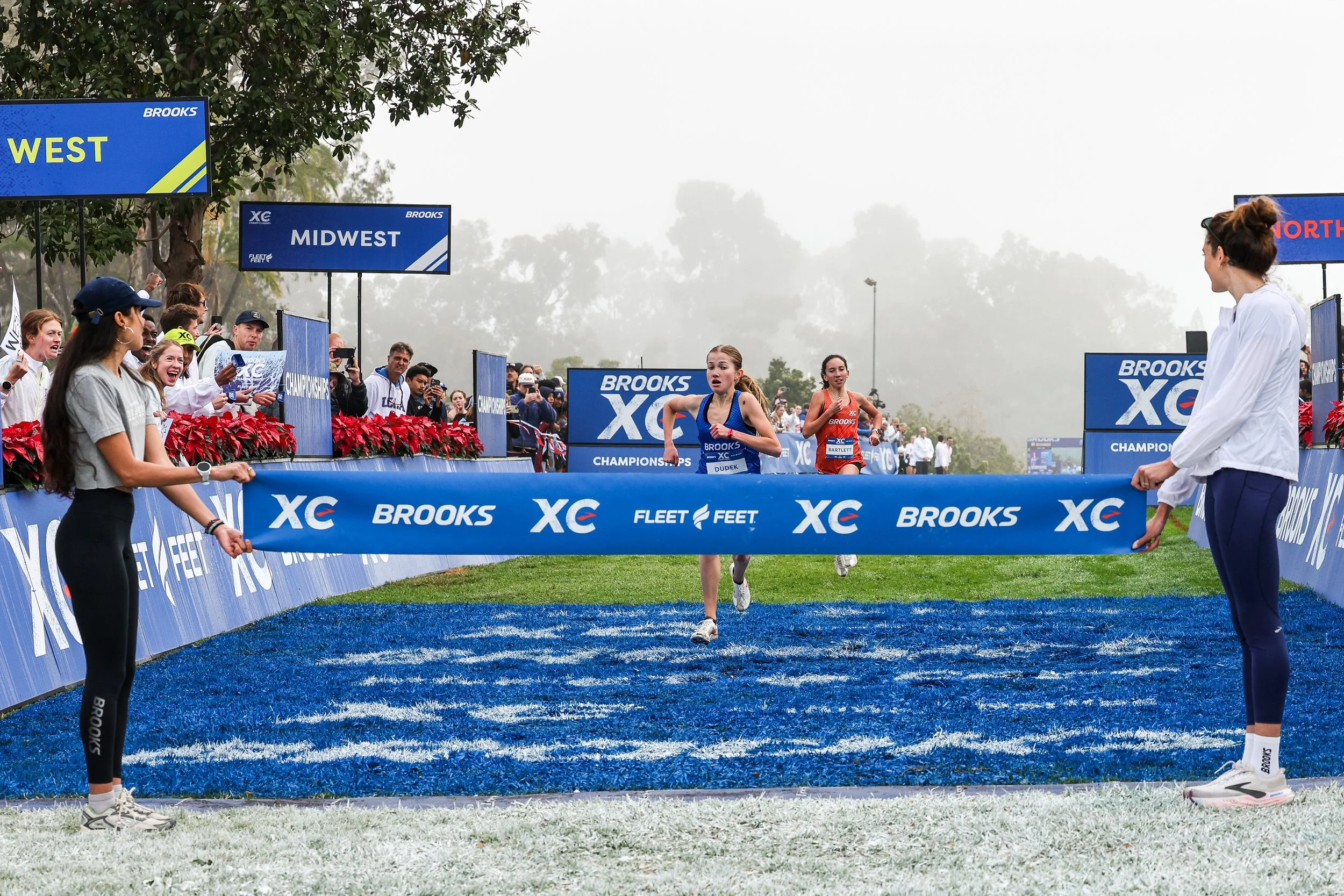 Natasza Dudek breaking the tape at the Brooks XC Championships