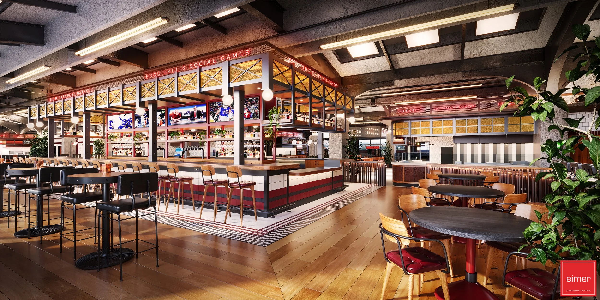 Interior of a modern restaurant with a sports bar theme, featuring high tables and chairs, a central bar with TV screens, and decorative plants.