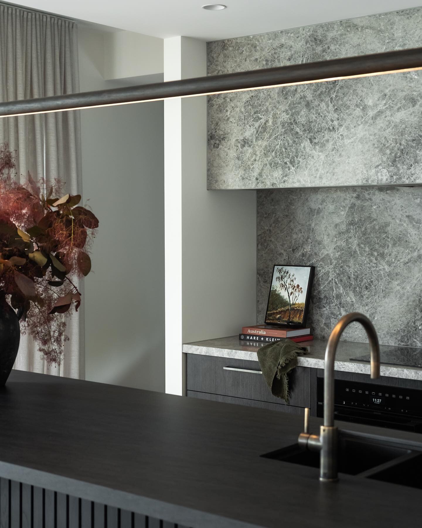 The kitchen is the starting point, setting the tone for the style and mood of the home.

We struck a balance of practicality, colour and finish. Natural limestone was selected  for the luxurious backdrop, and a durable Neolith sintered stone for the 