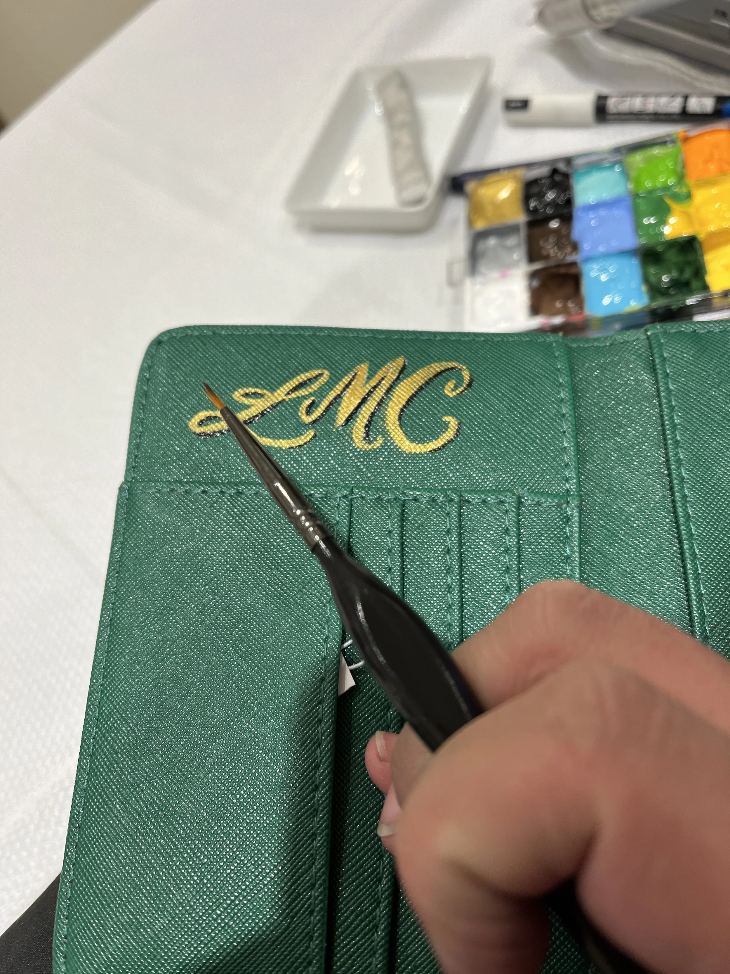 Leather Painting as an On-Site Artist at Kendra Scott