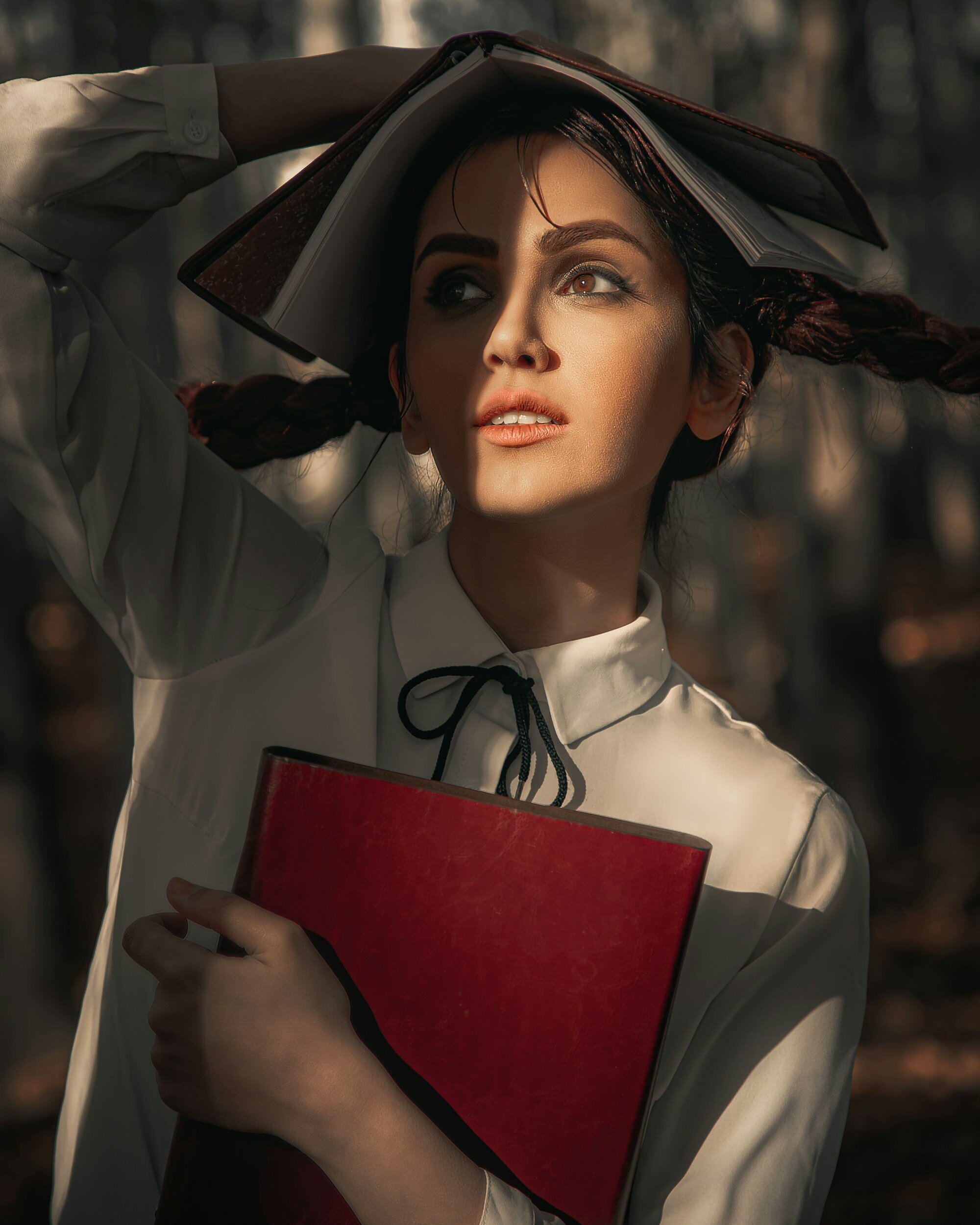 Woman holding books showing character and reputation.