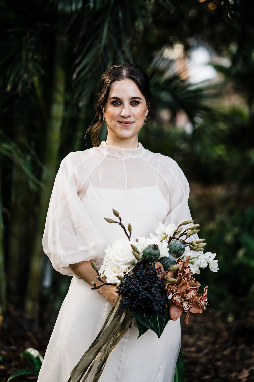  bride in her  wedding dress with her white and rustic fresh flower bouquet in City Farm Perth Australia 