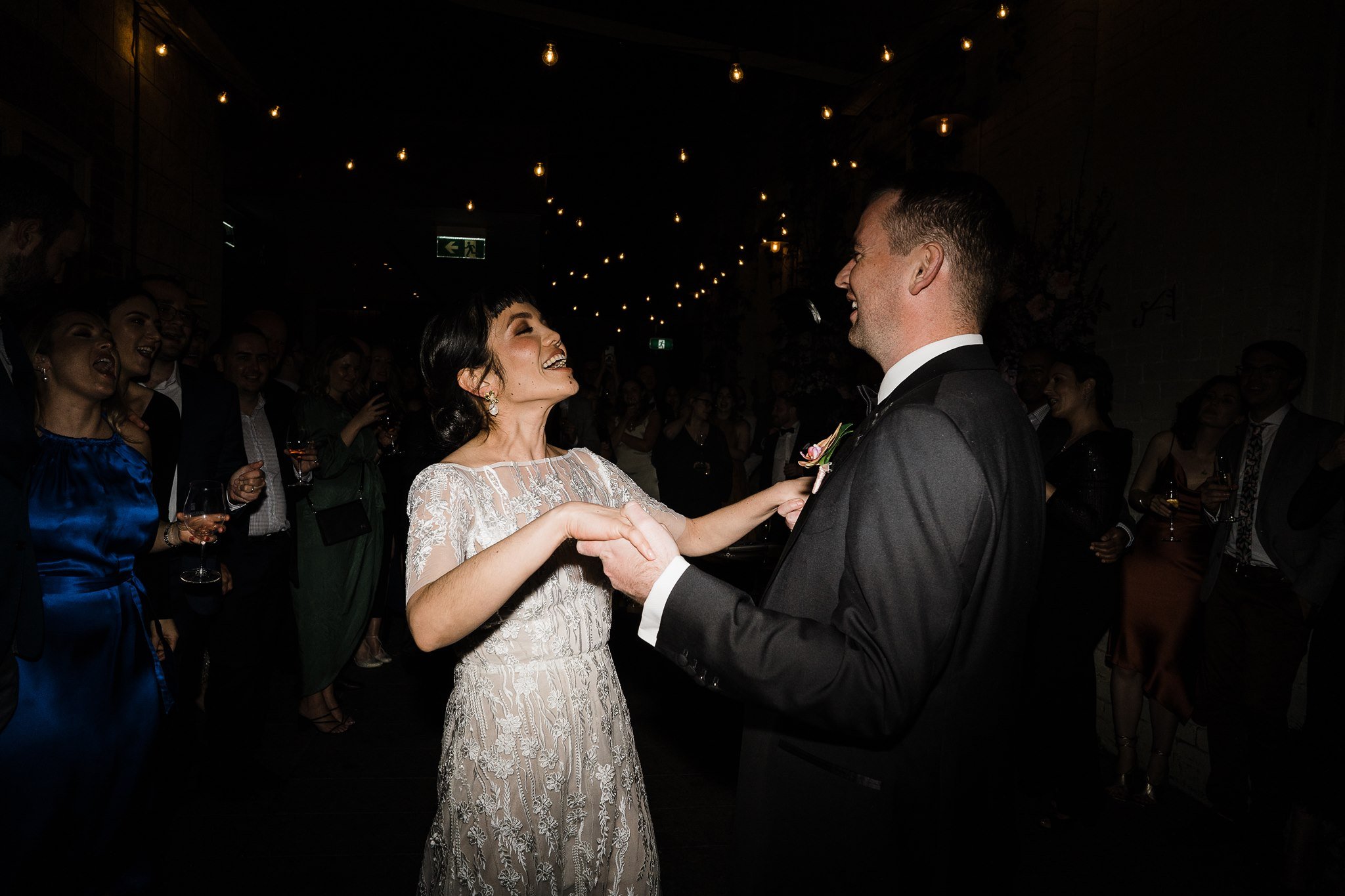  newly wed couple laughing in their after party in Guildhall Eventspace in Fermantle, Australia 