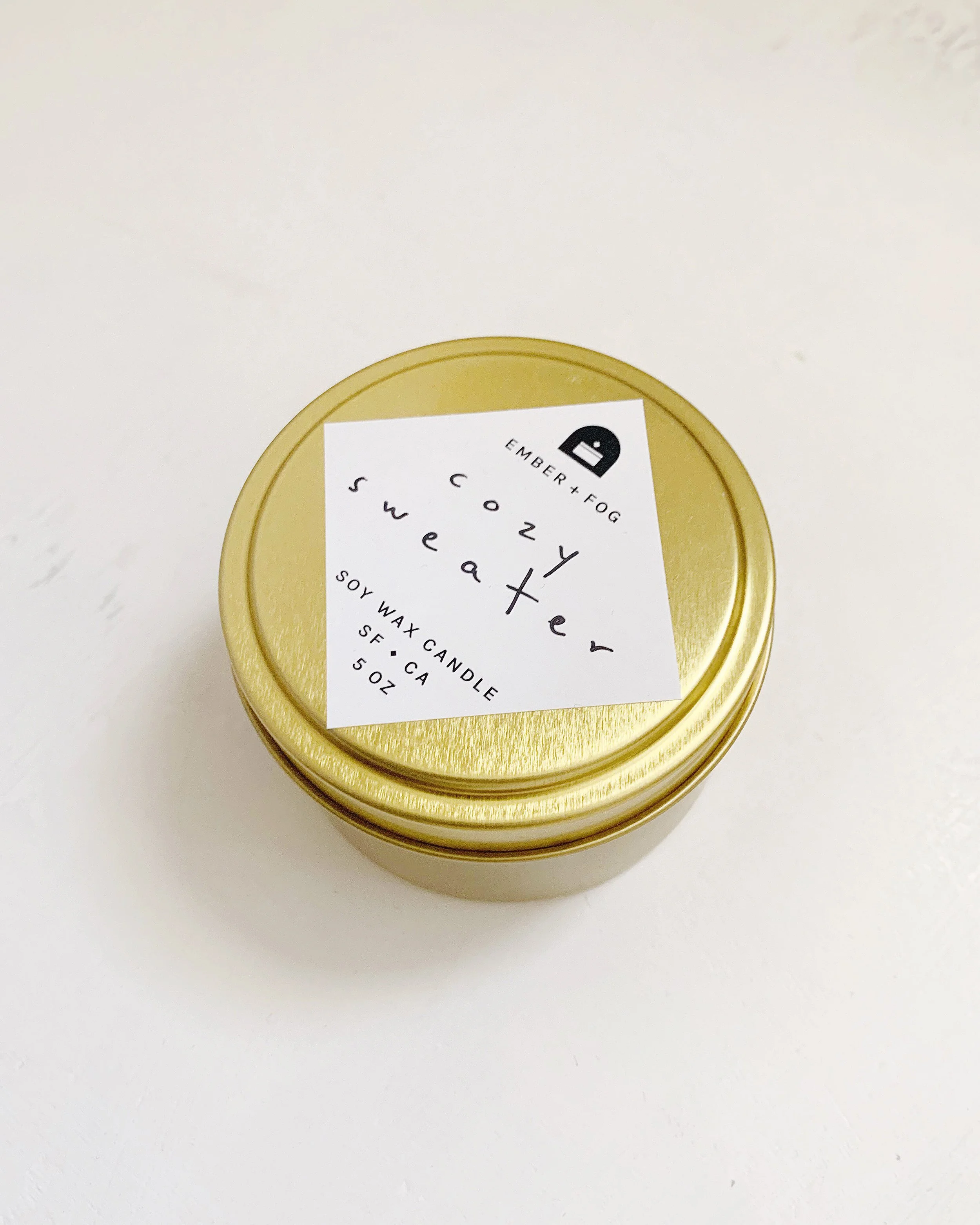 single-candle-angle-on-white-ember-and-fog-handmade-scented-holiday-fragrance-web-cozy-sweater.jpg