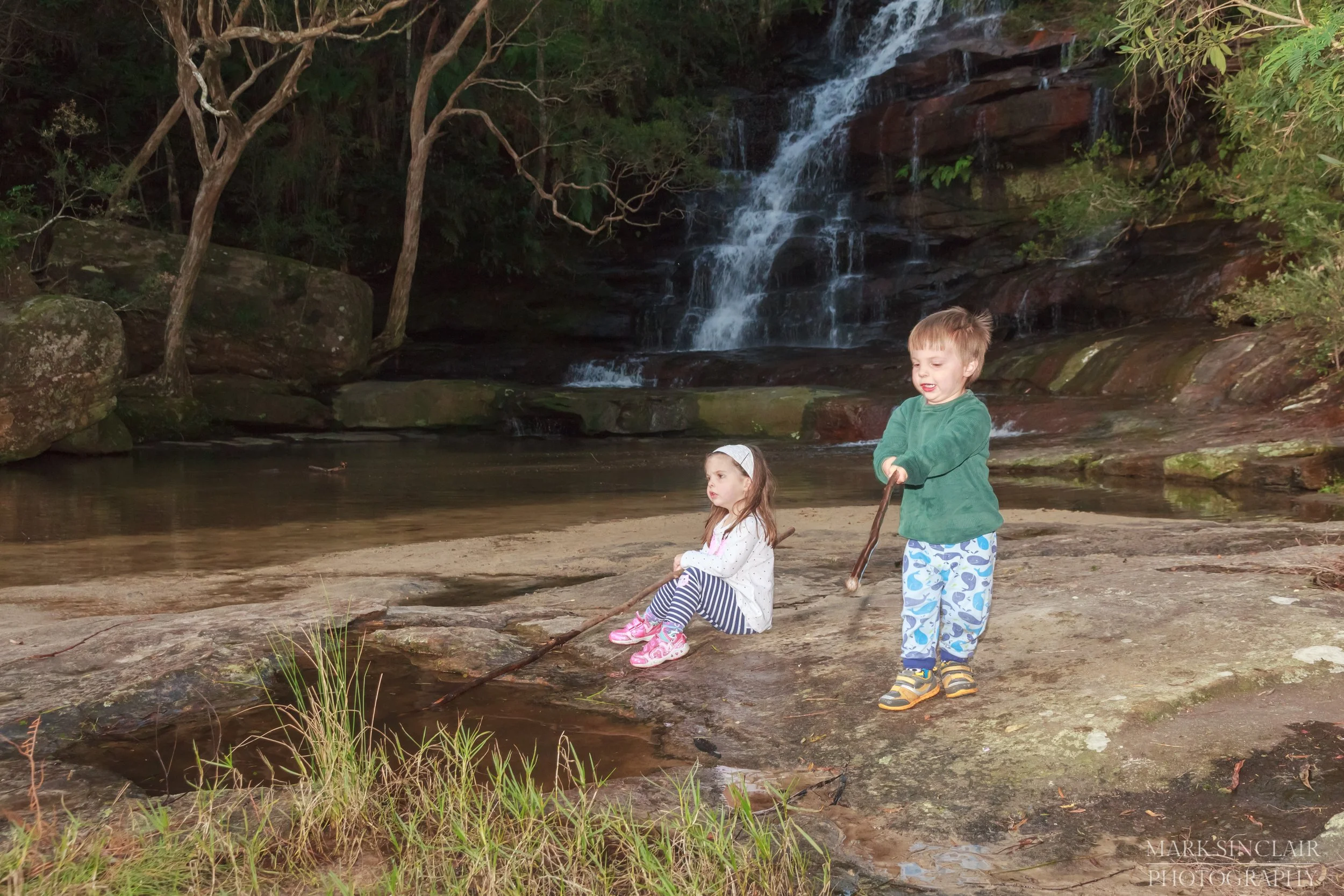   Getting a bit of fishing practise in with sticks at the end of a fun afternoon at the falls  