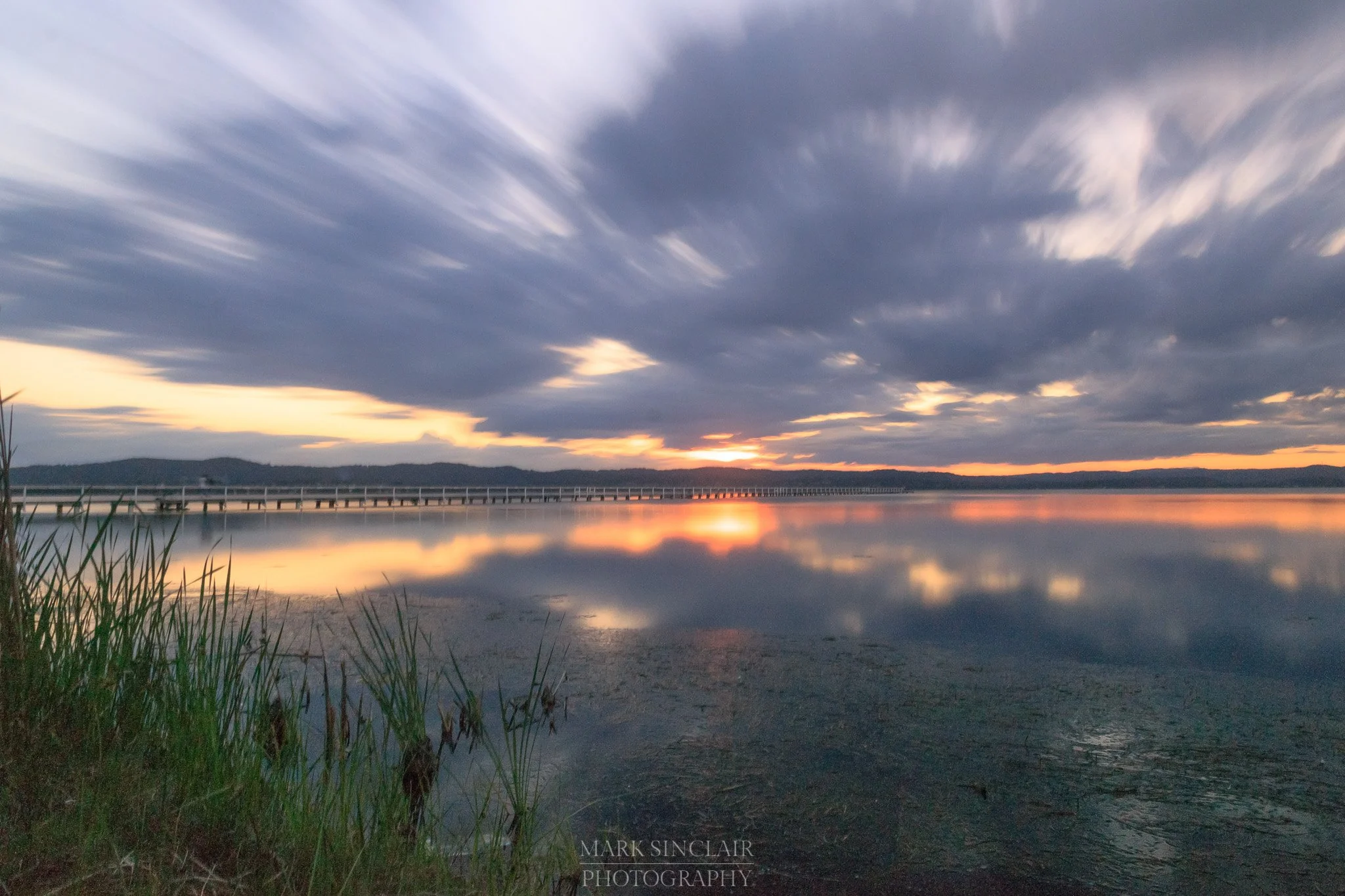   Long exposure shot just before sunset with the jetty in the background  