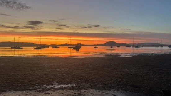   Sunrise at low tide over Tascott  