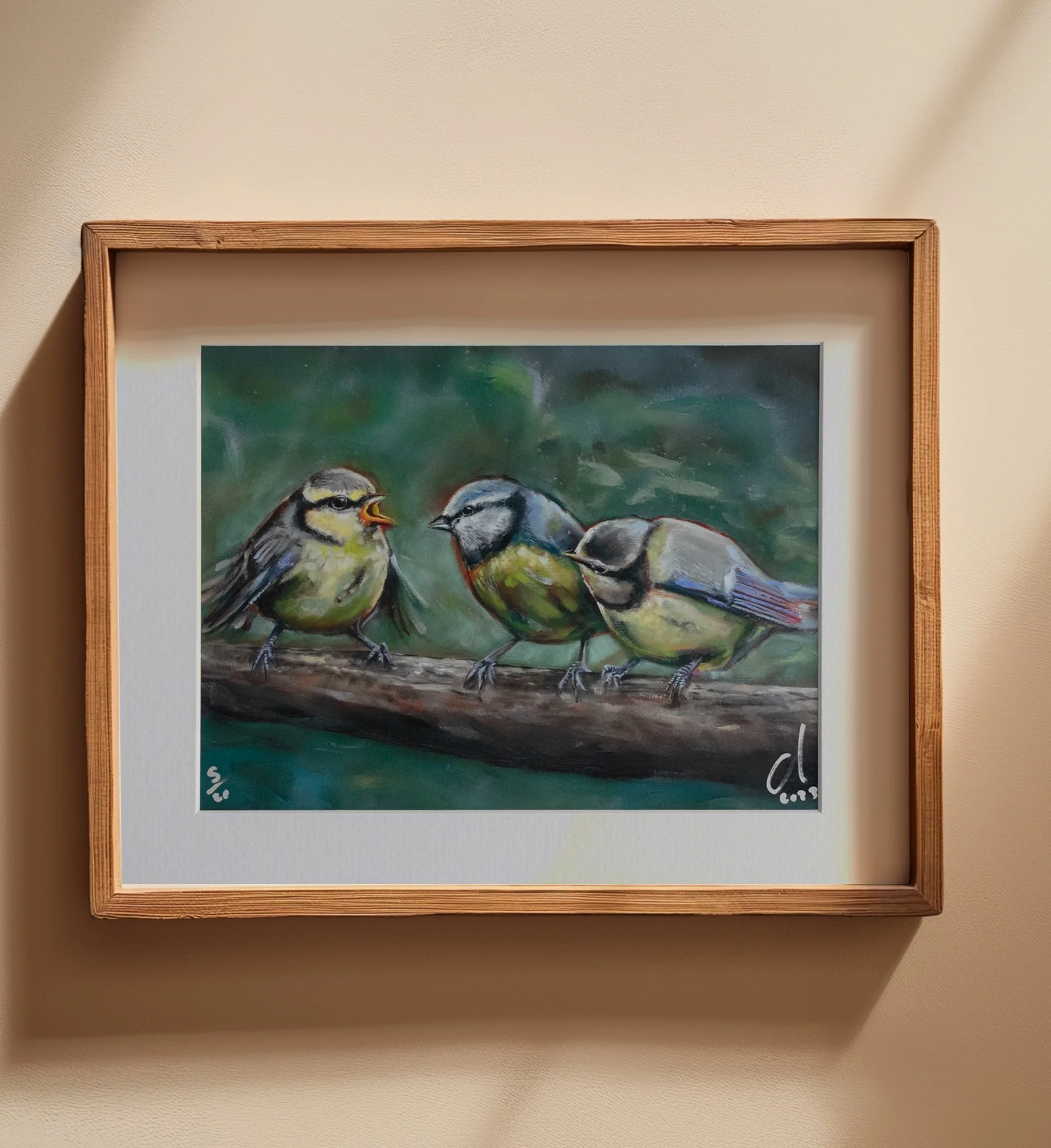 Blue Tit family on branch. Vivid blues and greens, great contrast. Baby bird flapping at mother bird, sibling looking.