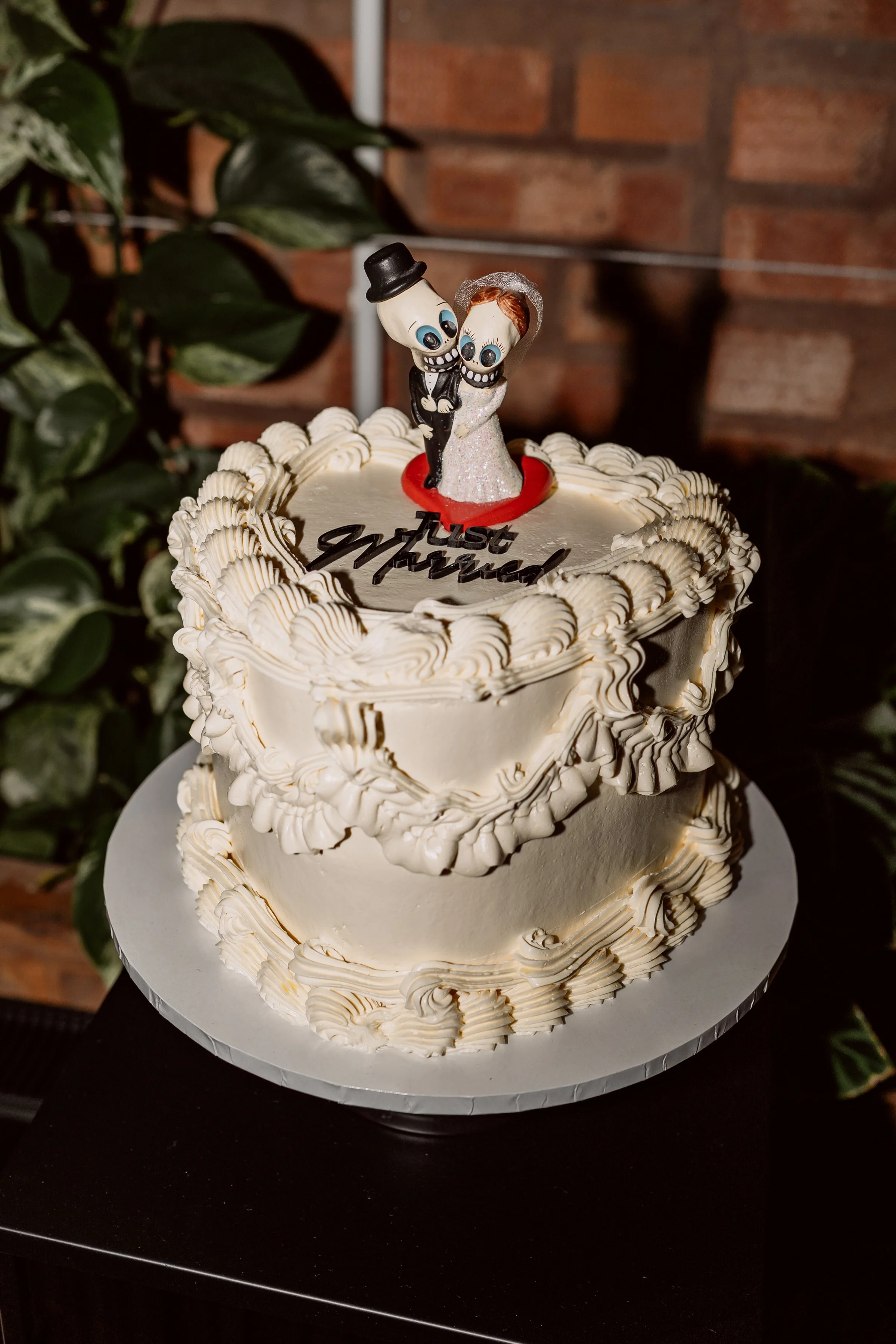 Wedding cake with Day of the dead themed cake topper on non traditional wedding day