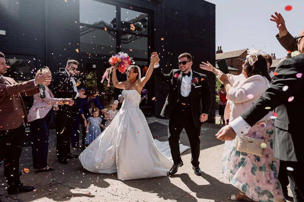 Bride and groom dancing through confetti at The Bond in Digbeth