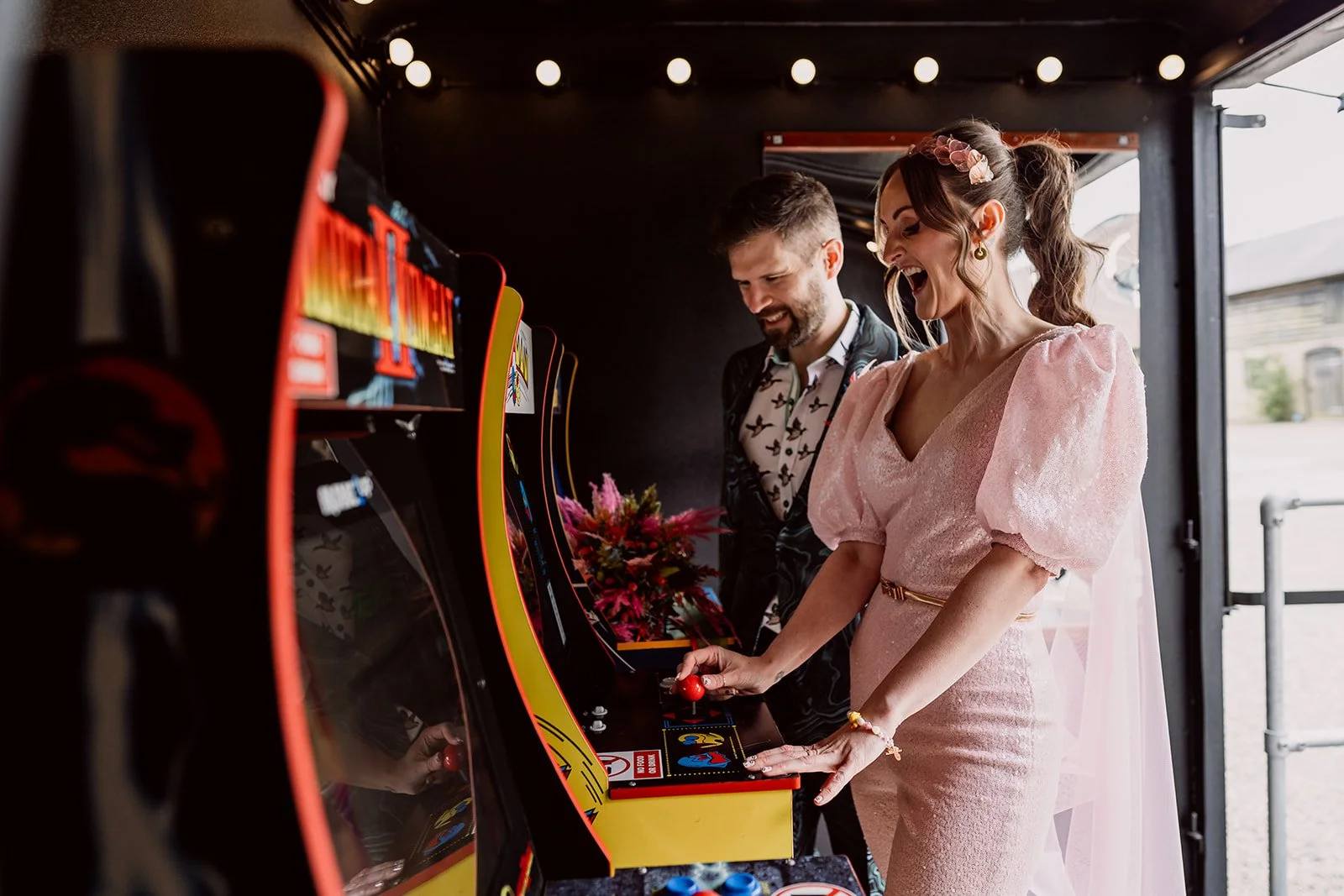 A couple playing arcade games during their wedding photography in Birimingham