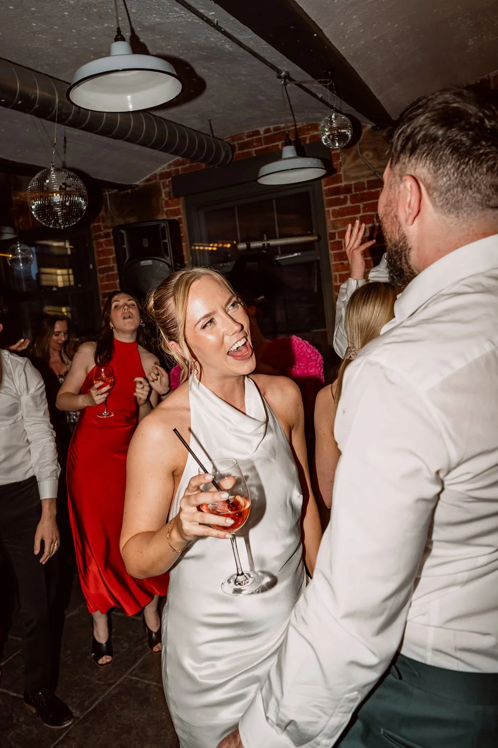 Bride dancing with groom on wedding day in Leeds