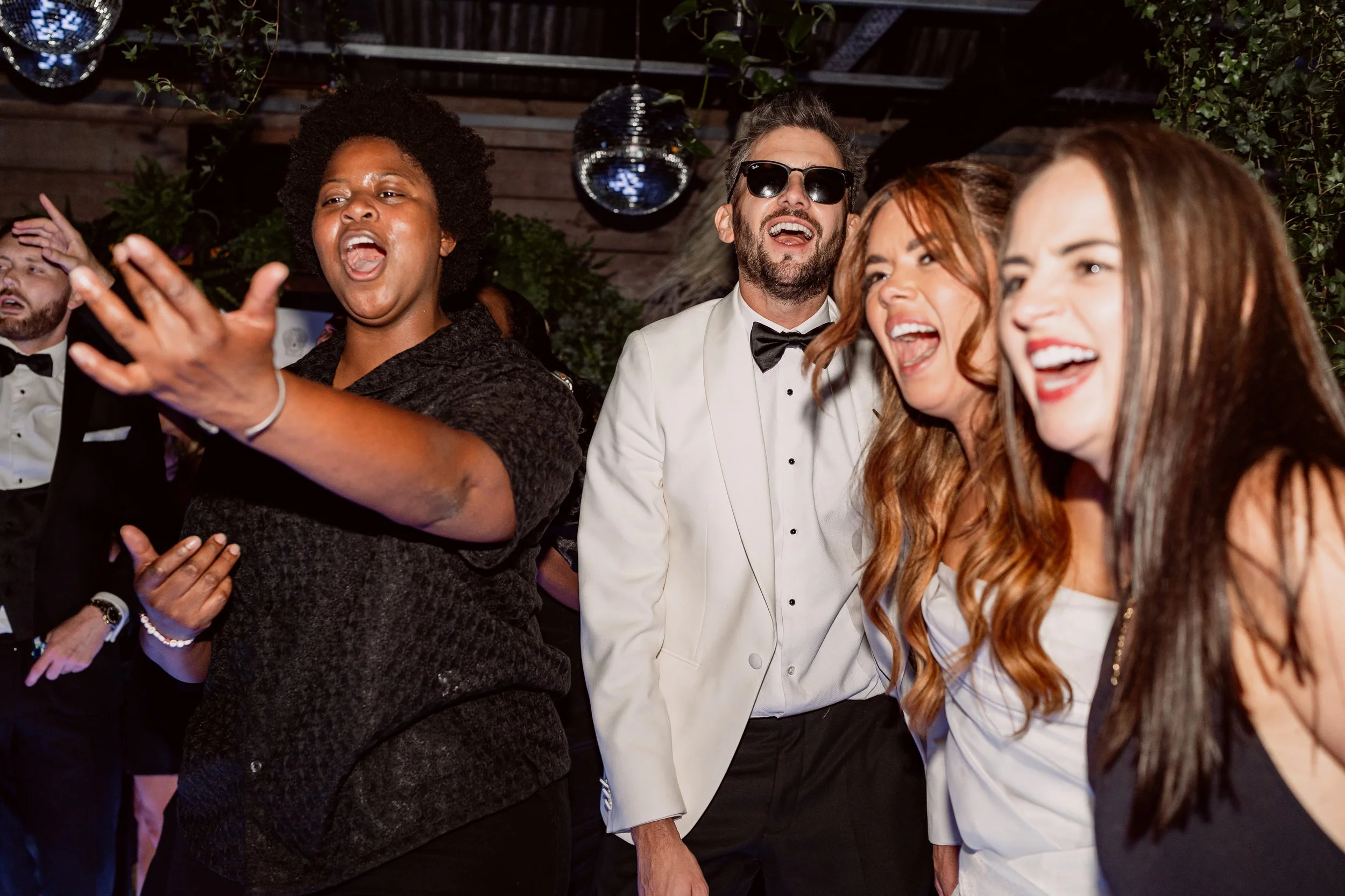 Bride and groom dancing with friends on Birmingham wedding day