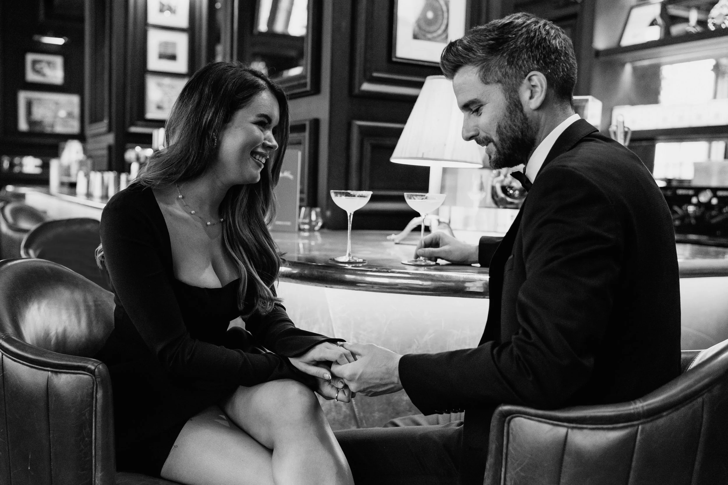 Bride and groom sat at a cocktail bar in London drinking margaritas