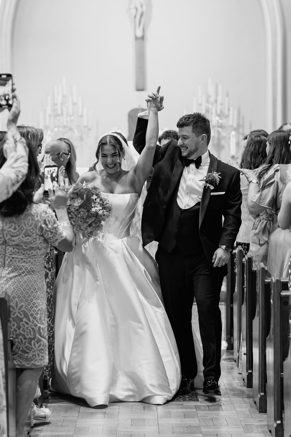 Bride and groom celebrating down the aisle on their Birmingham wedding day 