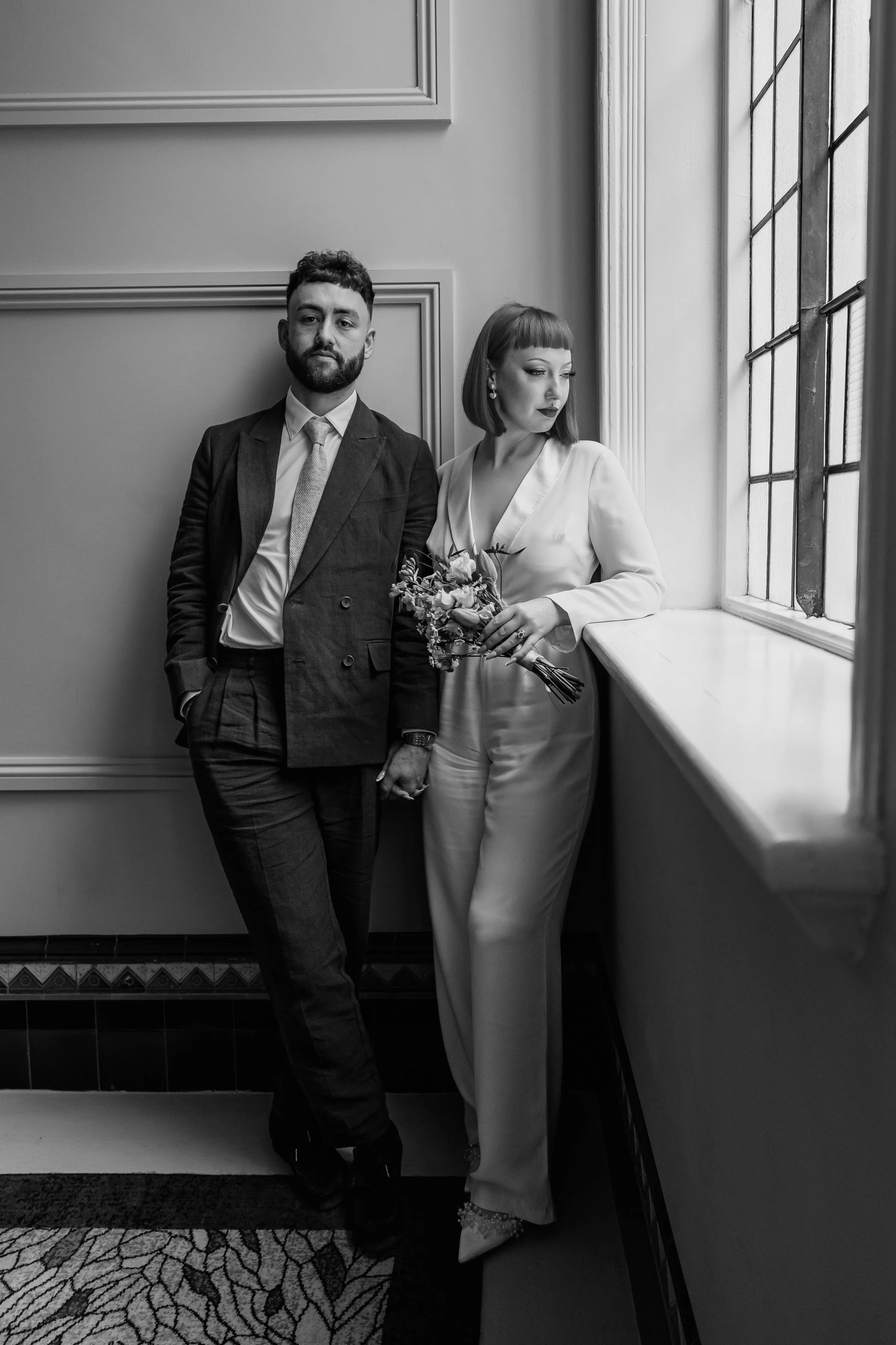 bride and groom on staircase at The Grand Hotel captured by Birmingham wedding photographer