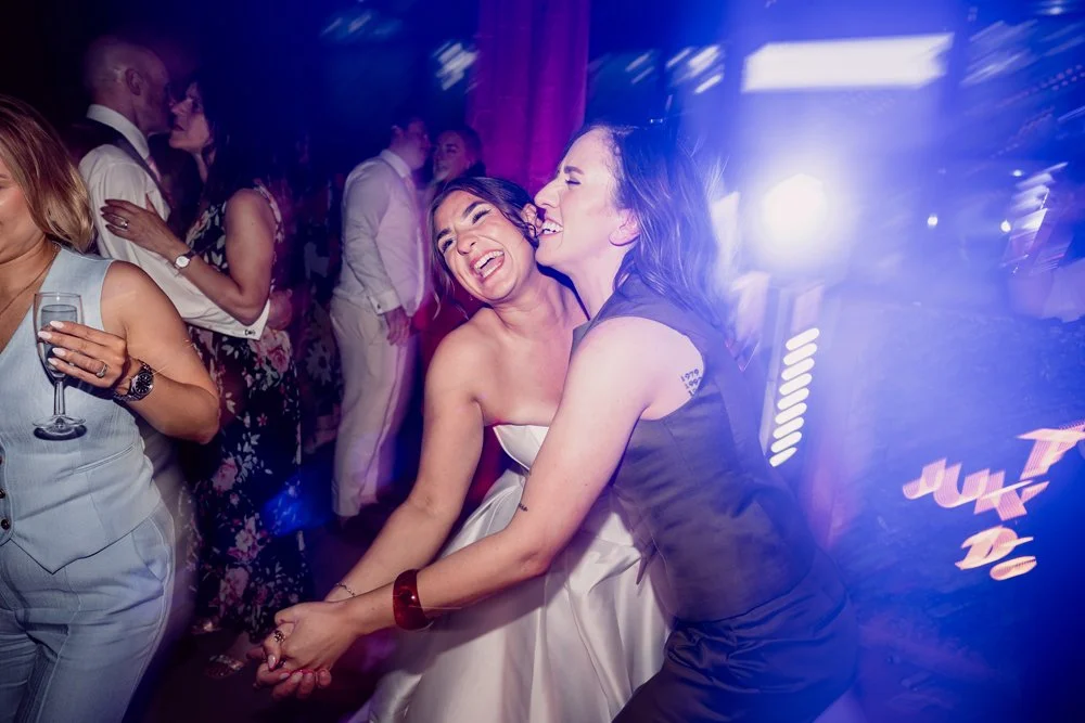 Bride dancing with guest on wedding day at The Bond in Digbeth