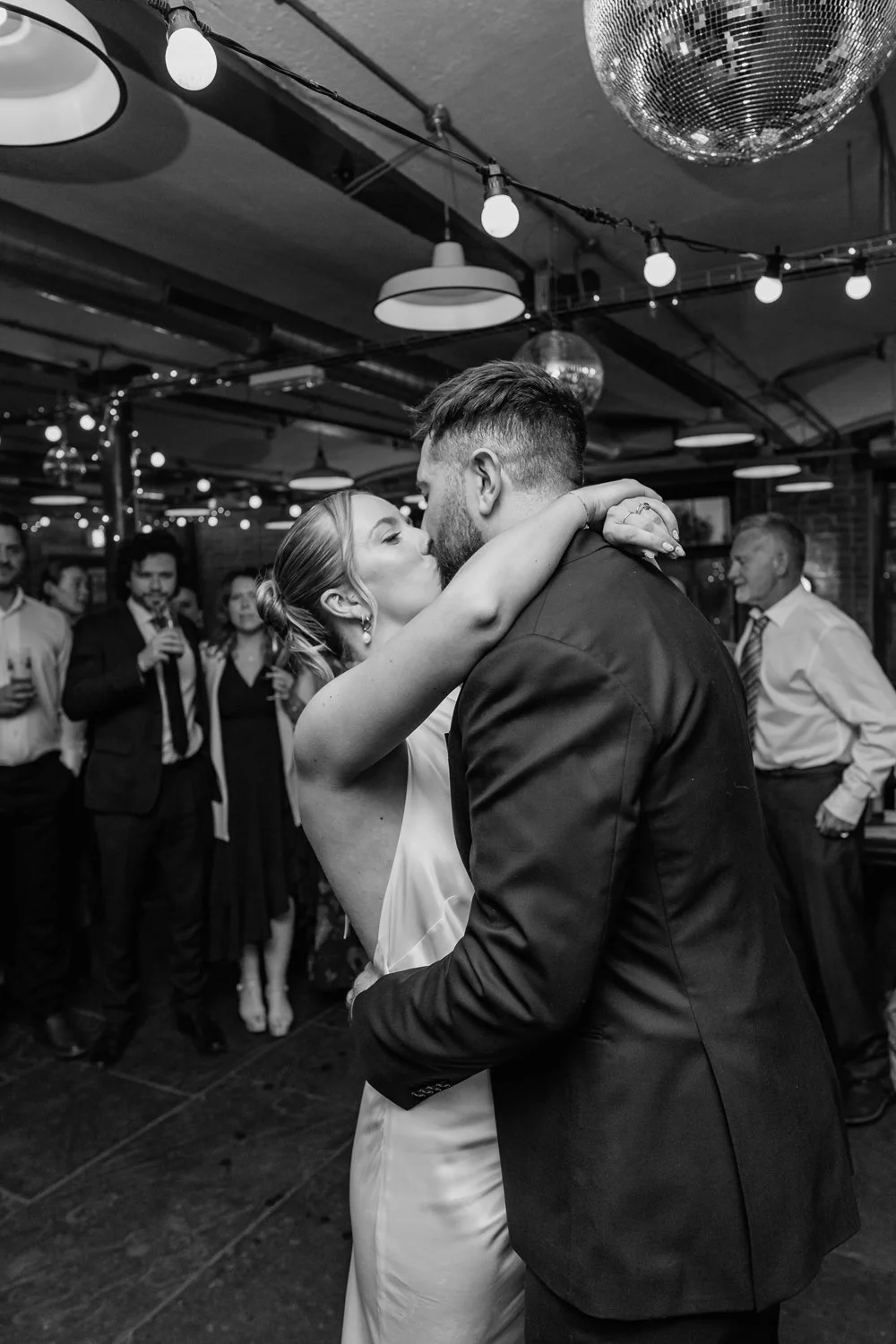 Bride and groom kissing during their first dance on their Leeds wedding day