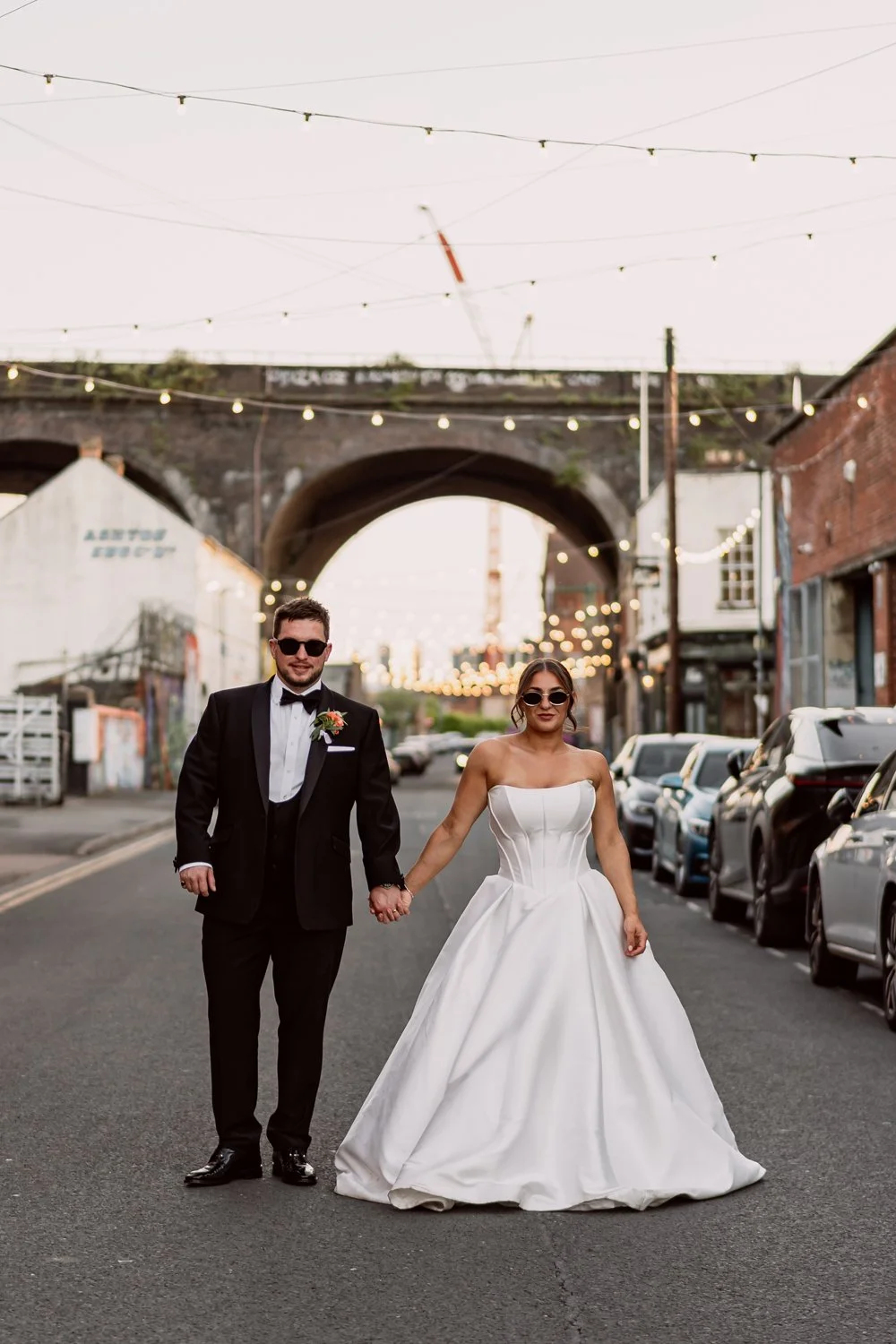 Couple with sunglasses on looking at the camera in Digbeth