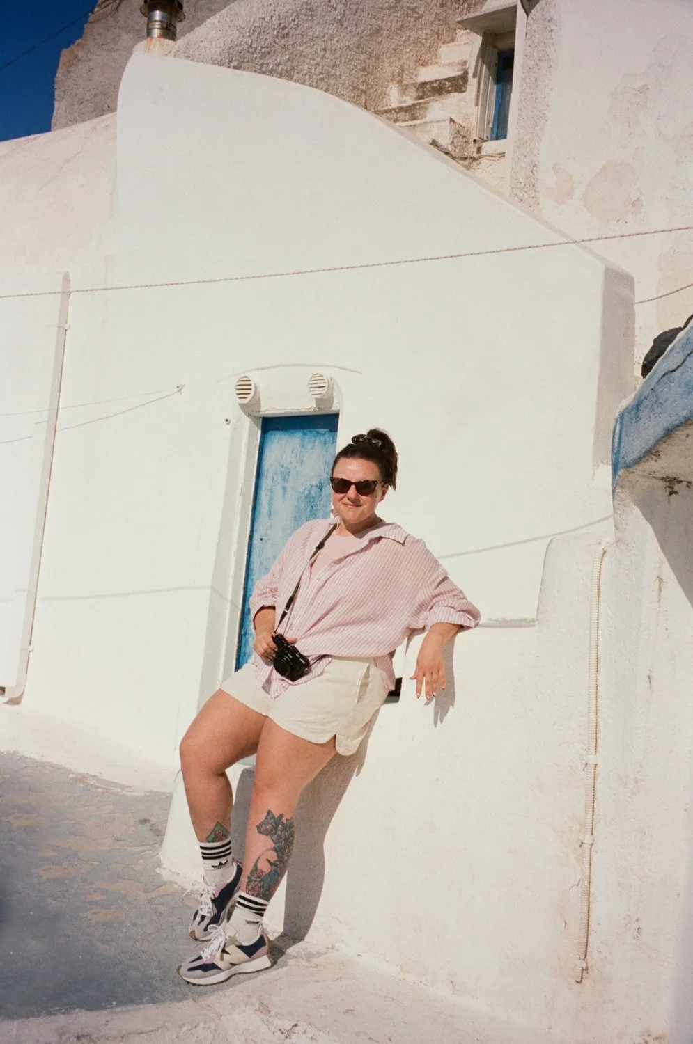Portraits of Steph, a Birmingham wedding photographer as she's holding her camera