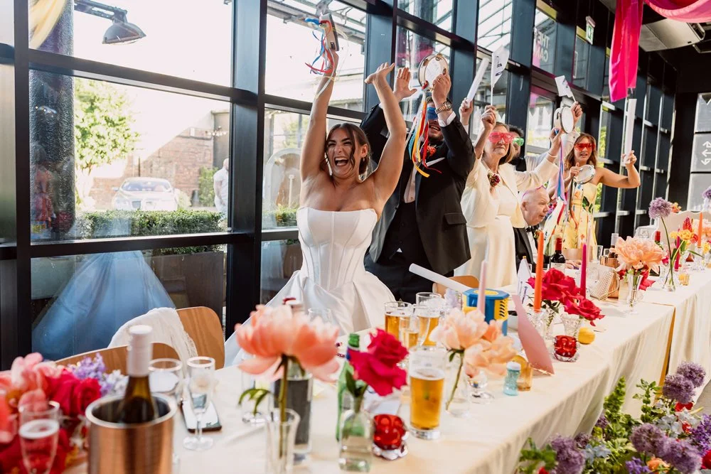 Top table dancing to bongo bingo on wedding day in Digbeth