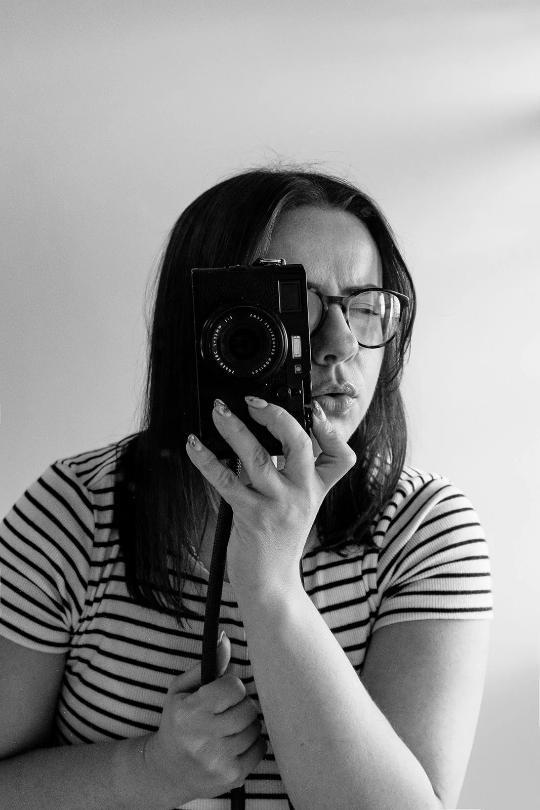 A black and white self portrait in the mirror of Steph a Birmingham wedding photographer