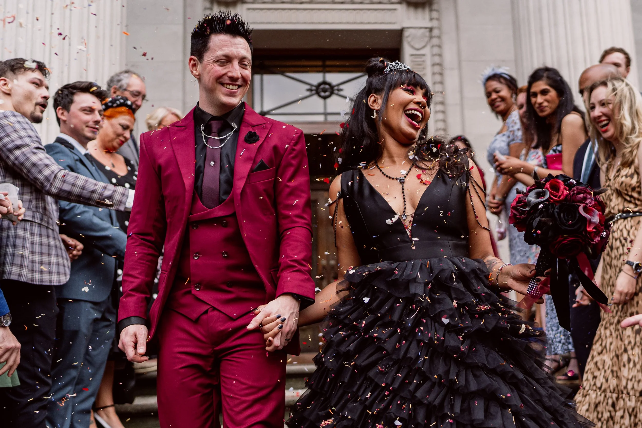 bride and groom walking through confetti on their inclusive wedding