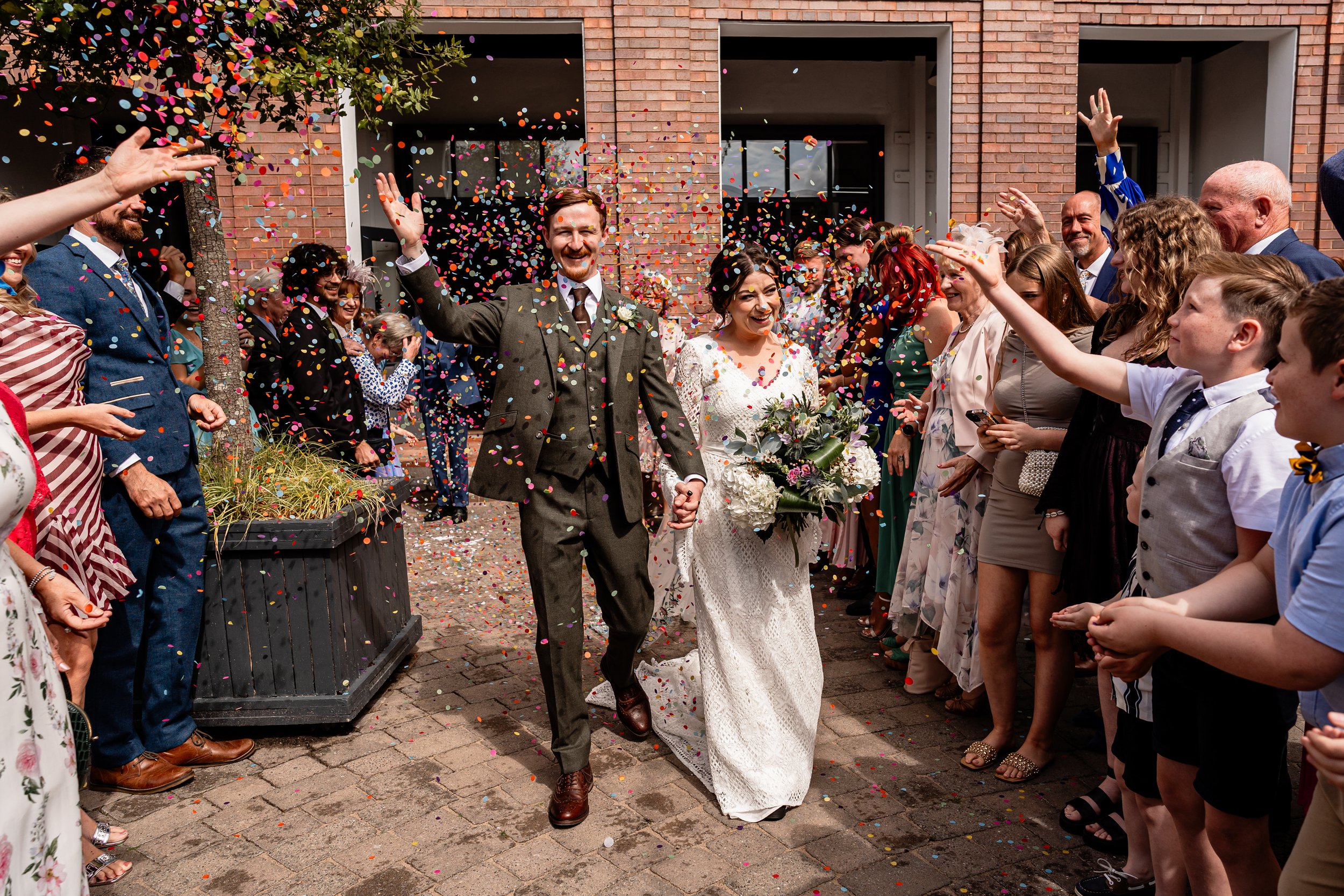 Couple during their confetti moment at their urban city wedding