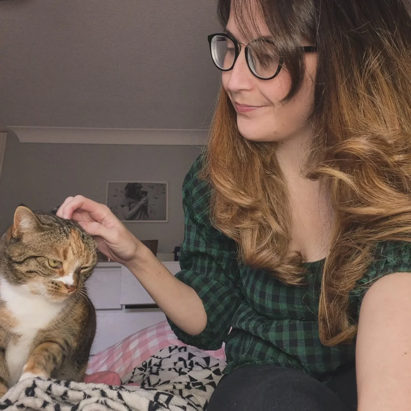 The illusive Birdy who is our shy and sweet little rescue cat. This might be one of the first pictures I've got with her since we adopted her in 2021. She loves cuddles but only on her terms.