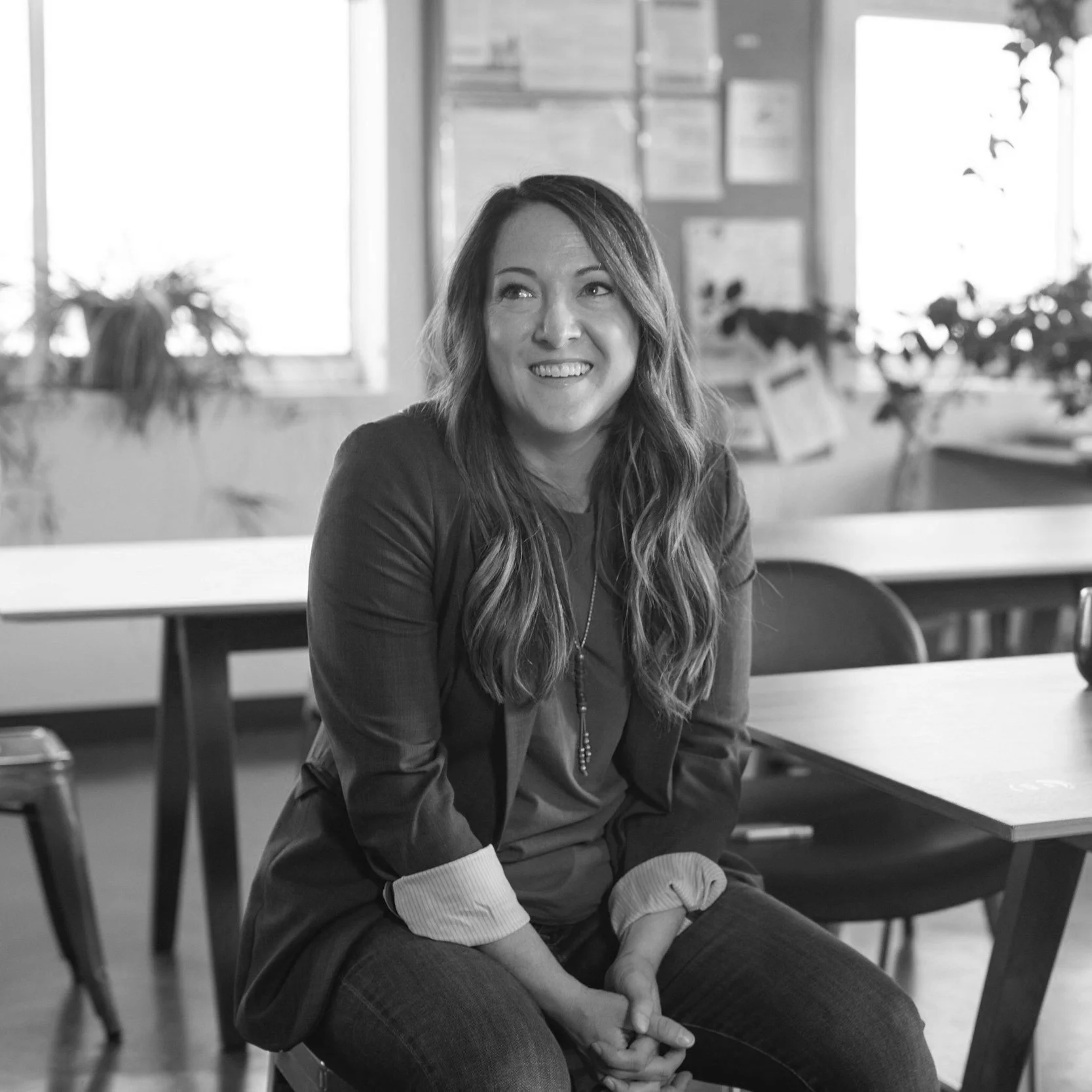 Smiling woman sitting in an office setting