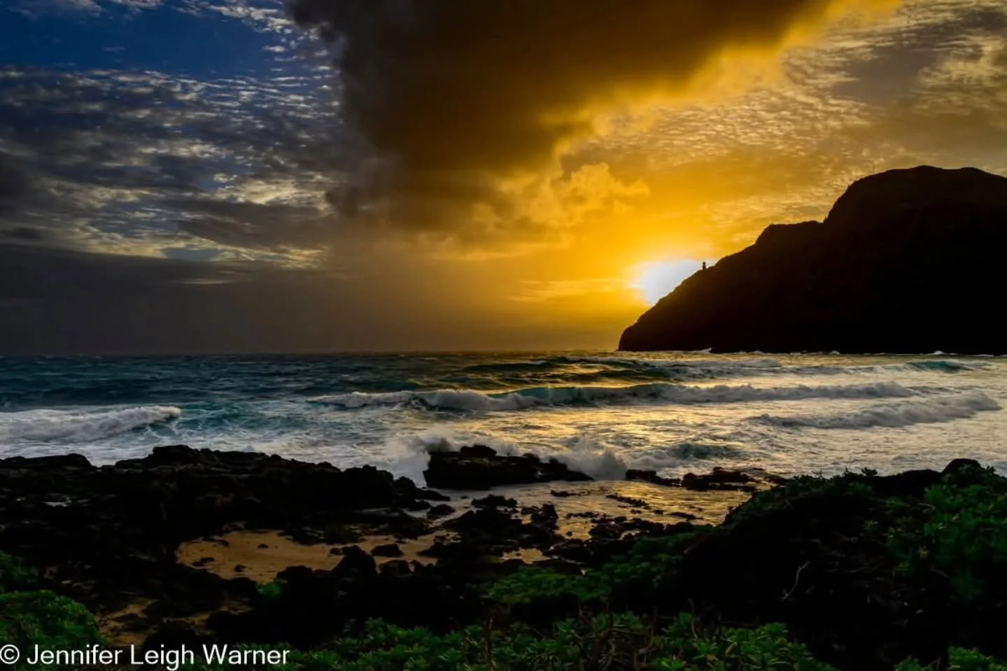 Imagine opening your eyes to this breathtaking vista golden sunlight streaming across volcanic cliffs as waves crash against ancient lava rock below. This is Hawaii, where every sunrise feels like nature's personal invitation to witness something ext
