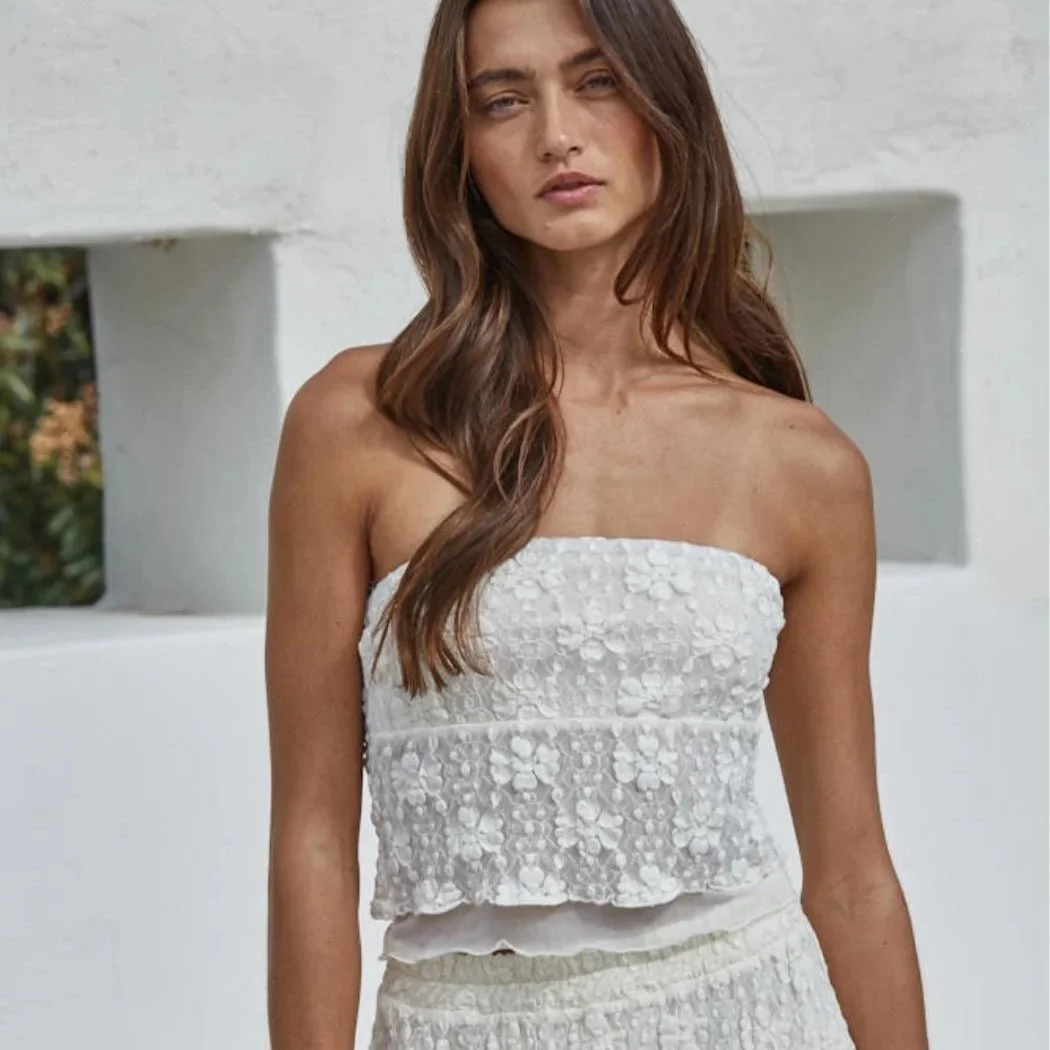 Spring fashion in Providence: a light, strapless ivory top.