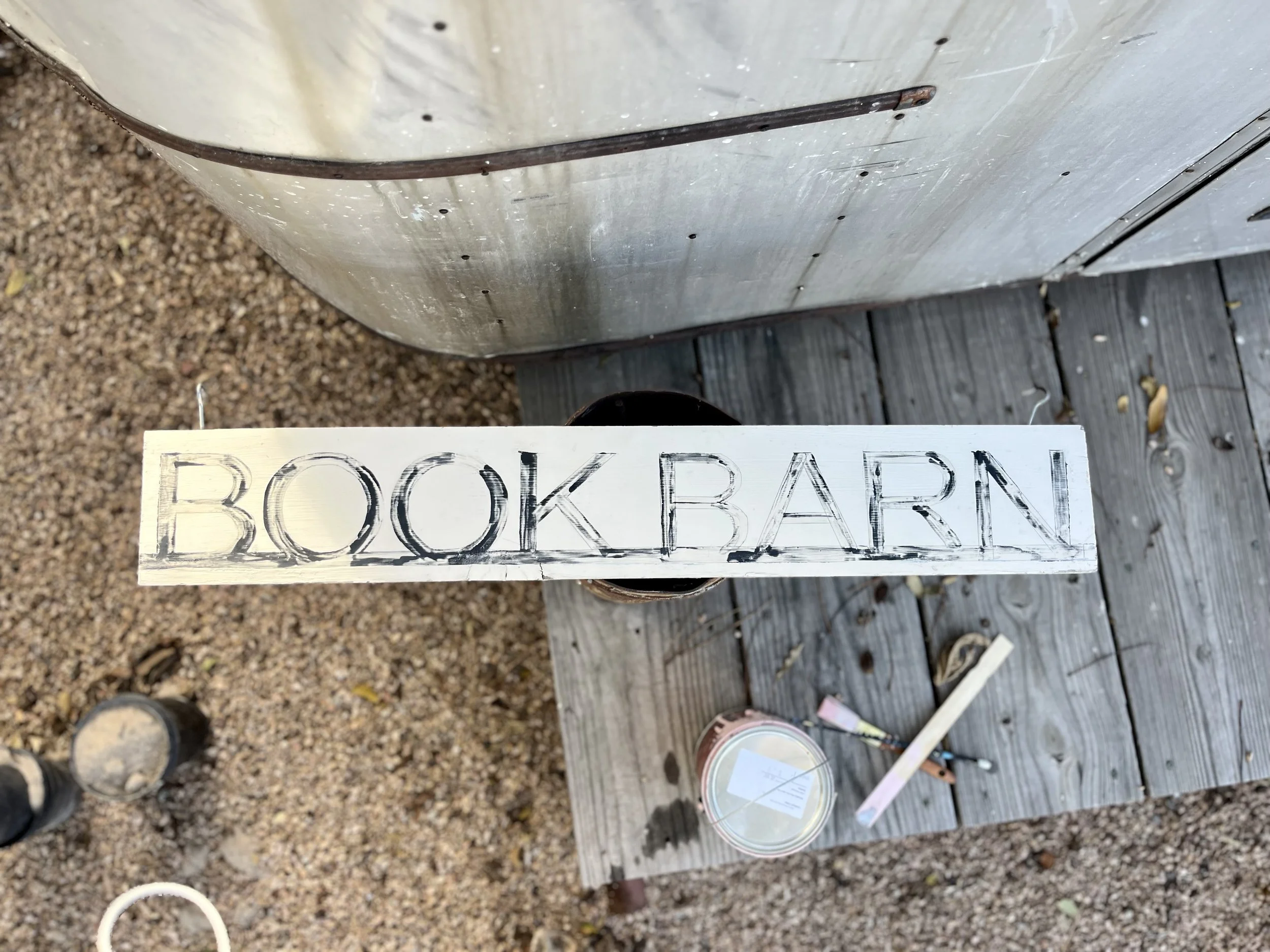 The Library's Book Barn sign needed a fresh paint job after years in the desert sun