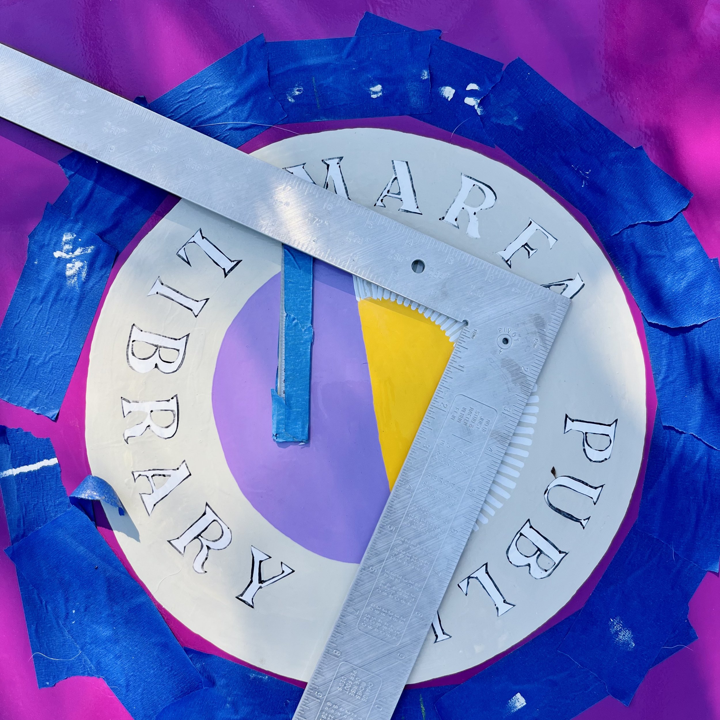 I worked with the Library Director to adapt the Library's logo colors to fit the theme of the newly painted book drop