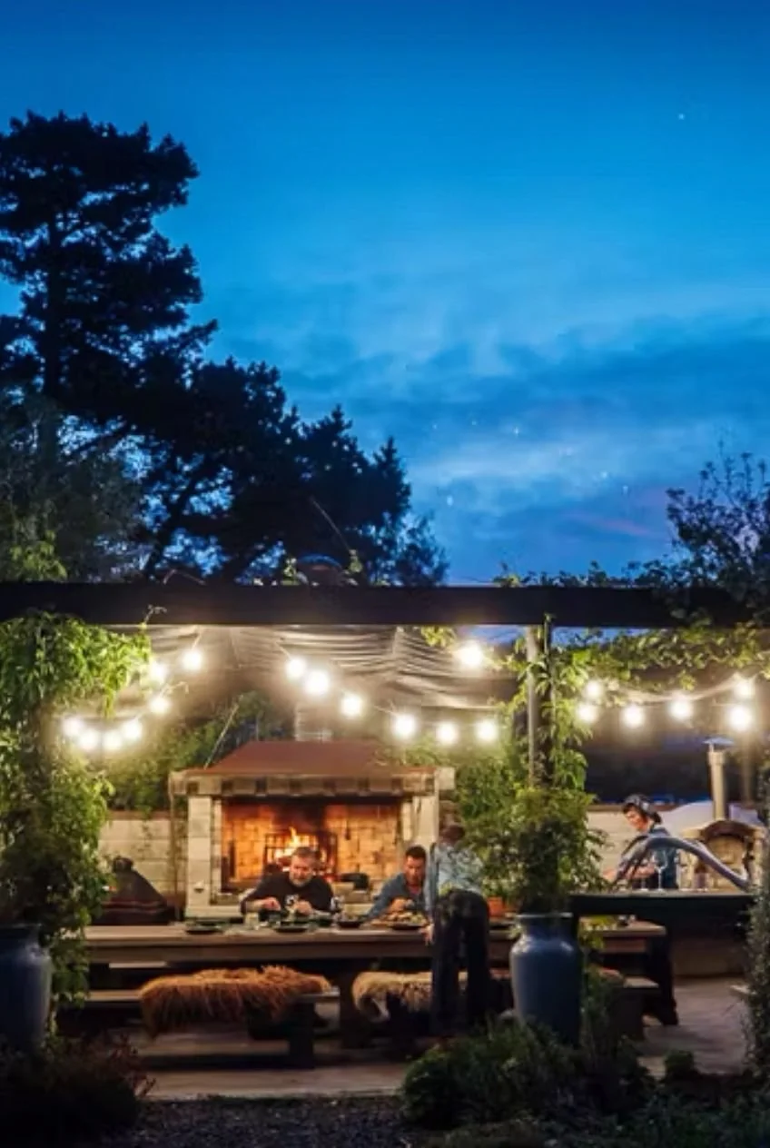 Guests enjoying an outdoor dining experience at Hapuku Kitchen Cooking School in Kaikoura, New Zealand