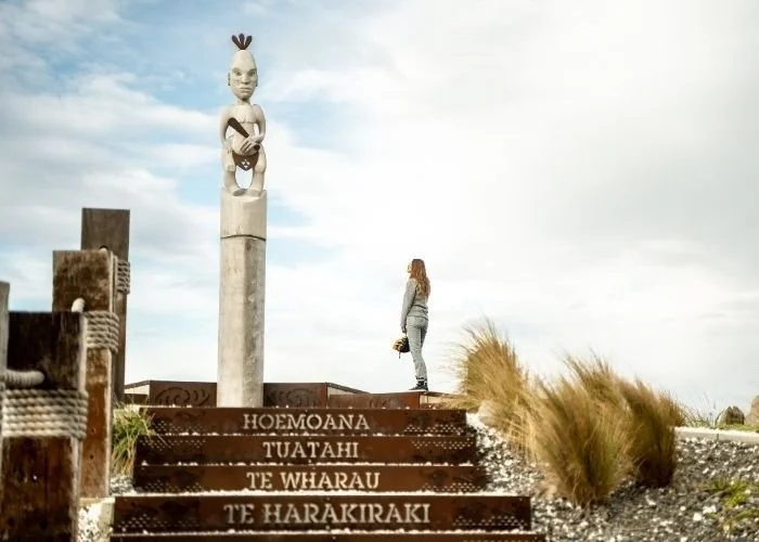 Looking up at a Māori sculpture on the coastal art trail, Kaikoura, New Zealand