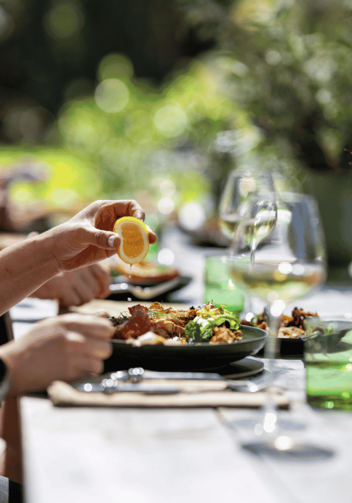 A squeeze of lemon from the garden over a freshly made dish at Hapuku Kitchen, New Zealand