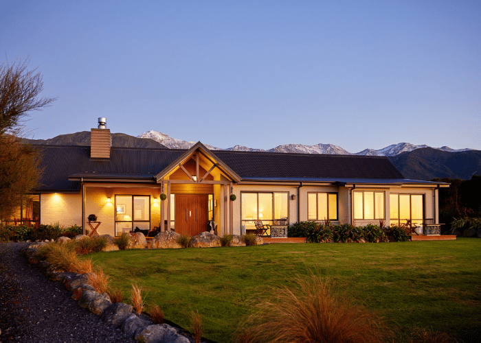 Manaka Lodge at dusk at the base of the Kaikoura mountains