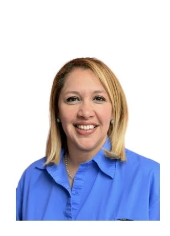 Head shot of a female with a white background and a blue button down. Big smile, short blonde hair, light skinned. Program Coordinator & ACT Instructor.