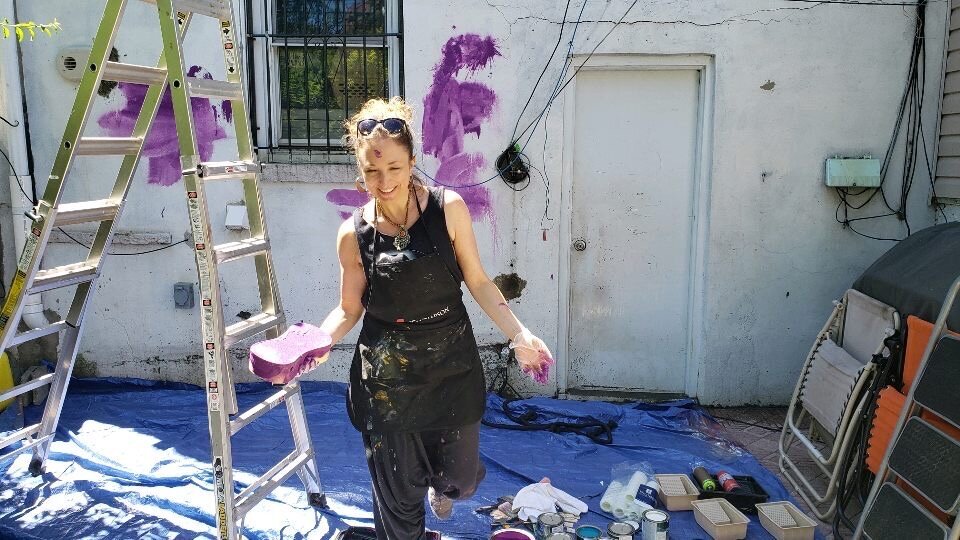 Throwing paint soaked sponges! Note that I had the tarp to protect the concrete pavers, but the client asked me to remove it so that the paint splatters and stains would extend onto the floor. He truly embraced the creative process and I will forever
