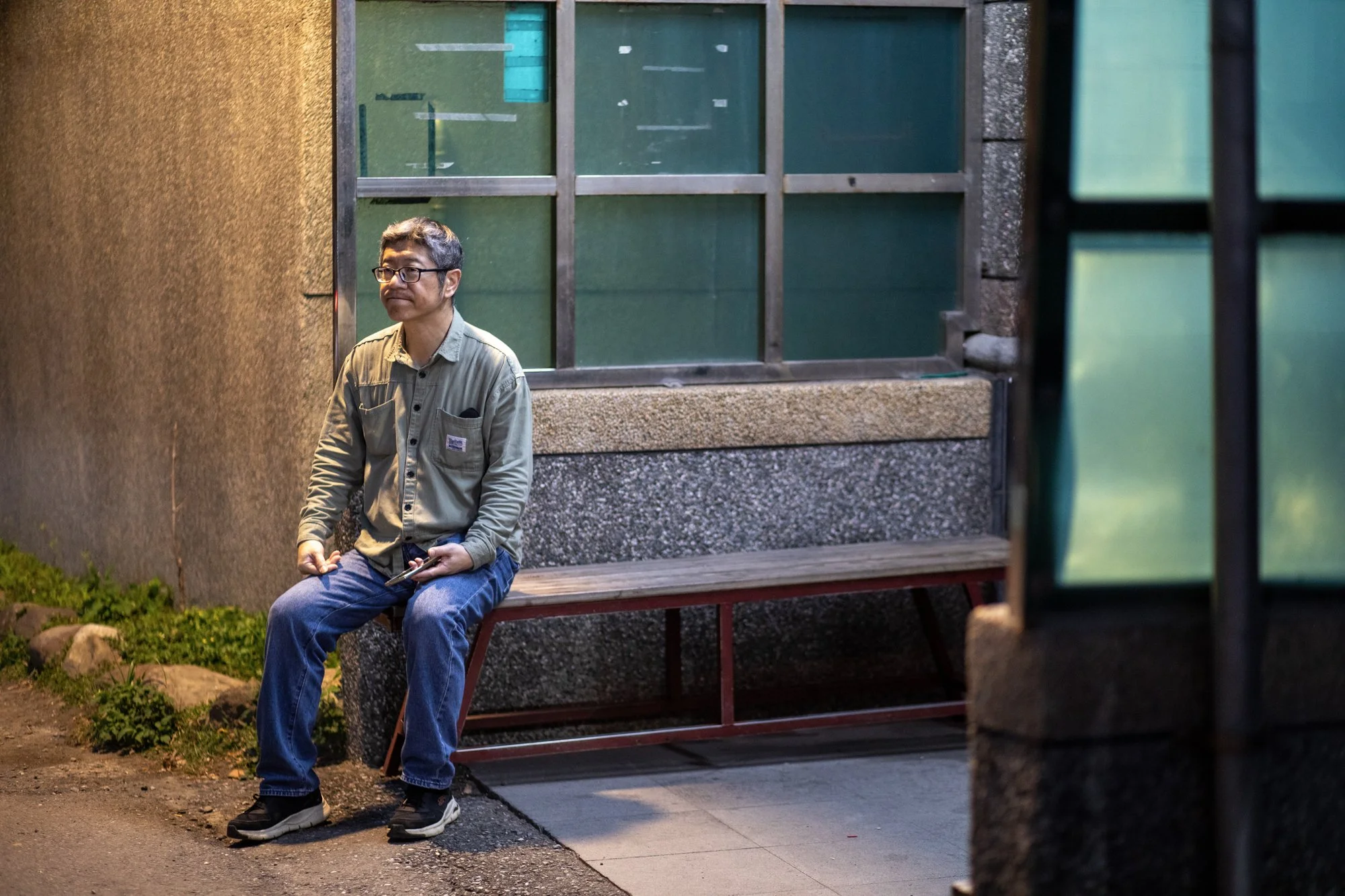 1. Man waiting at bus station.jpg