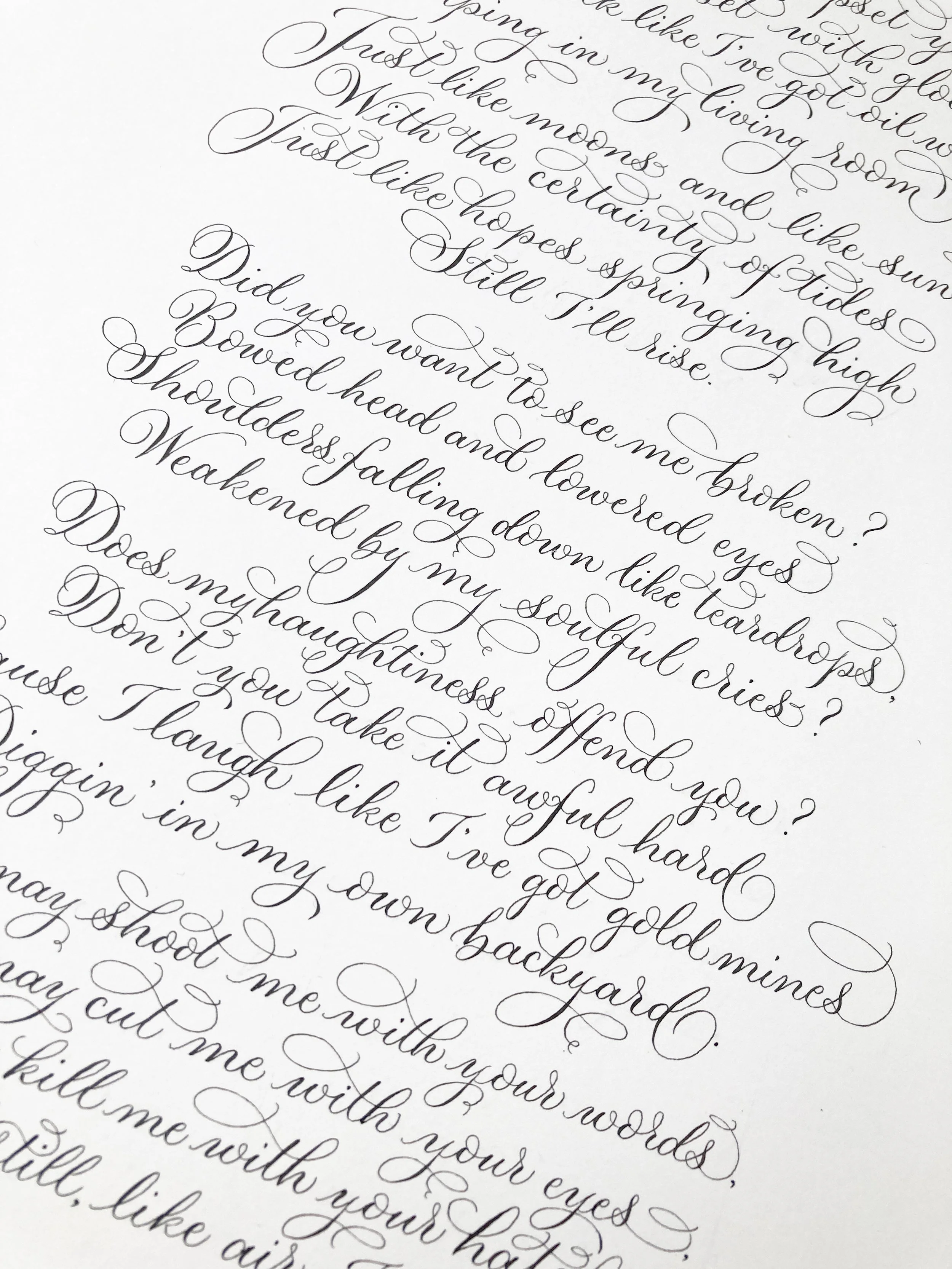 Flowing modern calligraphy commission of Still I Rise - a poem by Maya Angelou. Written with dip pen and ink by Claire at By Moon and Tide Calligraphy north west UK