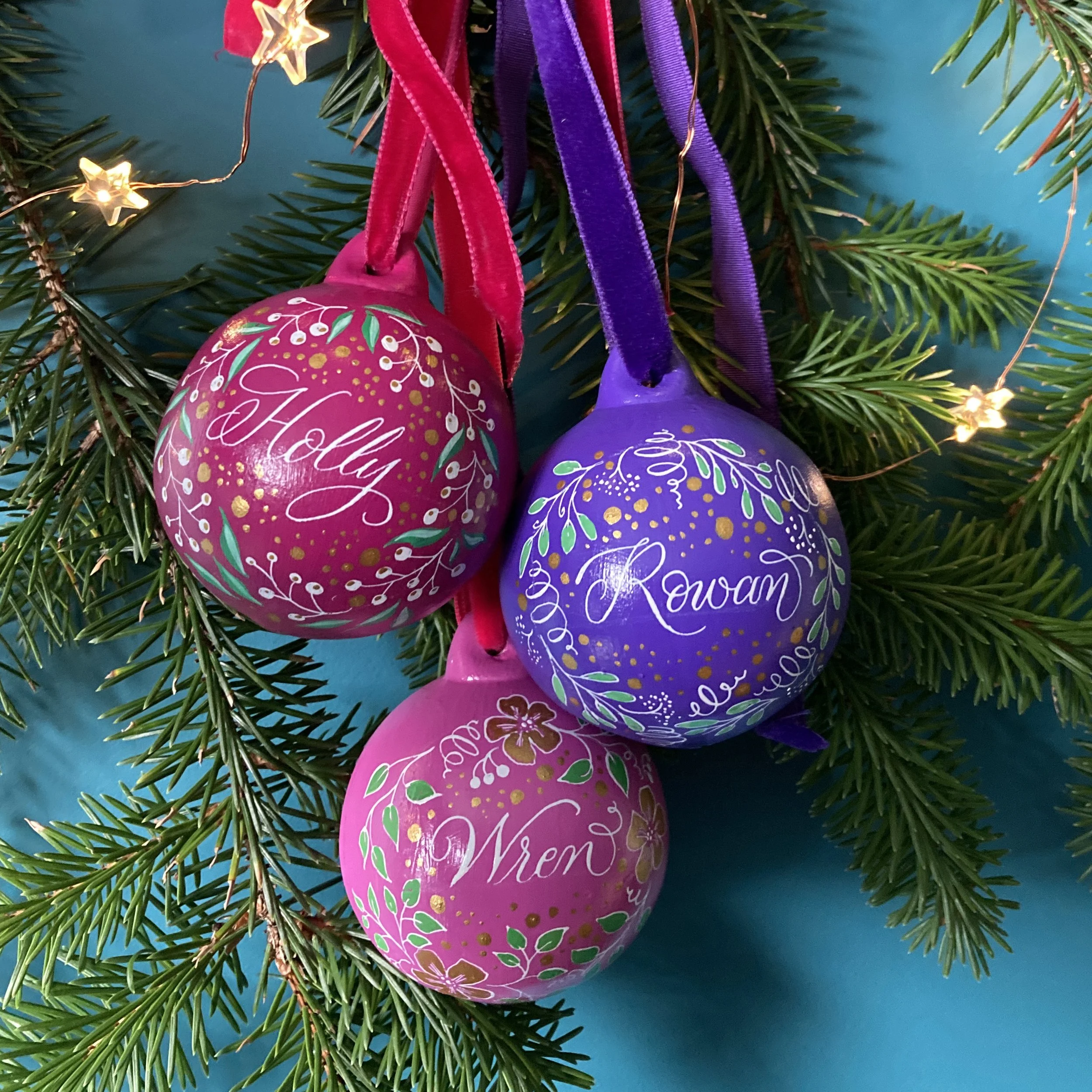 Personalised baubles for Christmas with hand calligraphy