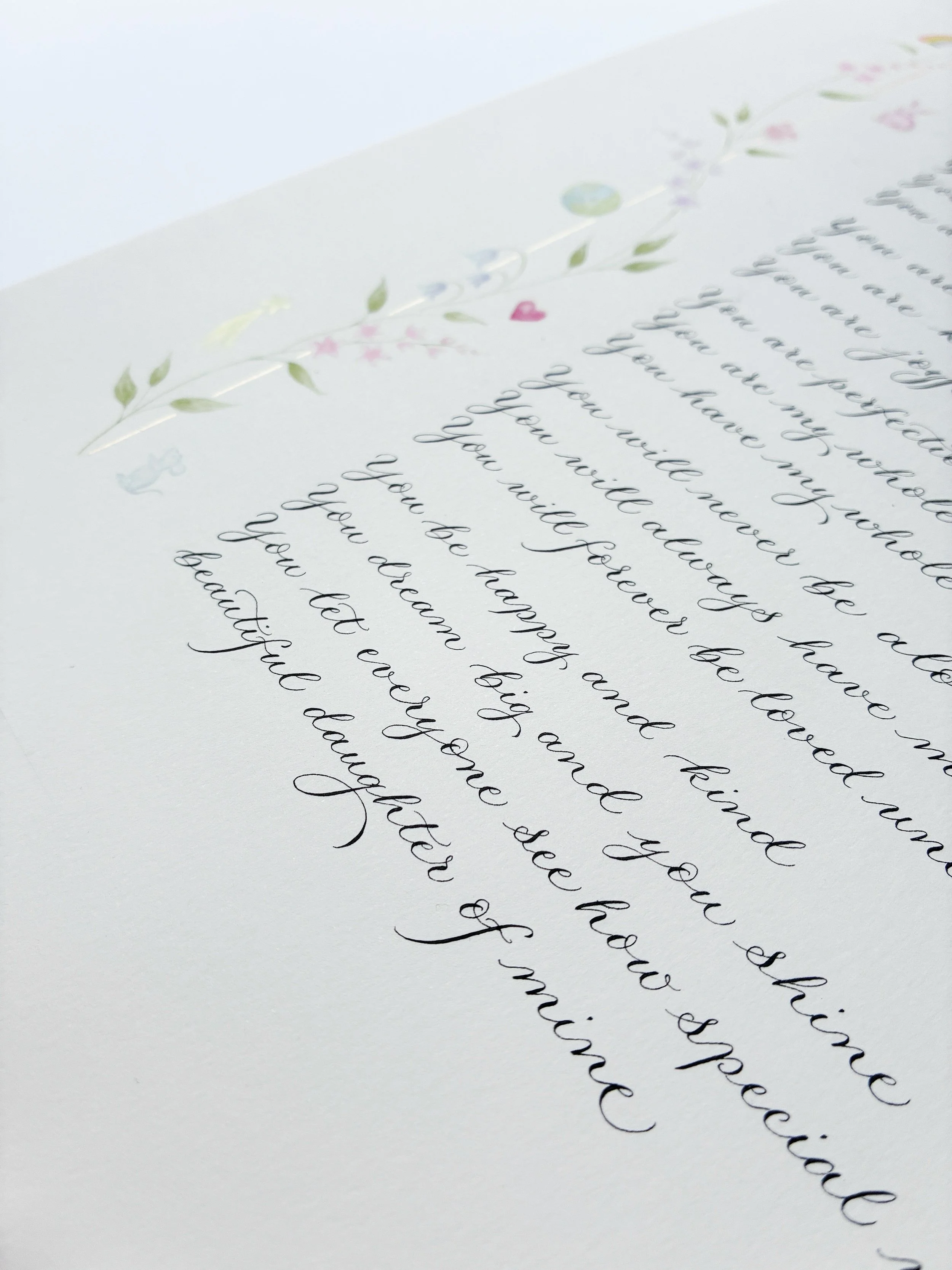 Calligraphy poem extract with pink heart illustration, flowers and gold border, and the last line ending 'beautiful daughter of mine' | By Moon & Tide