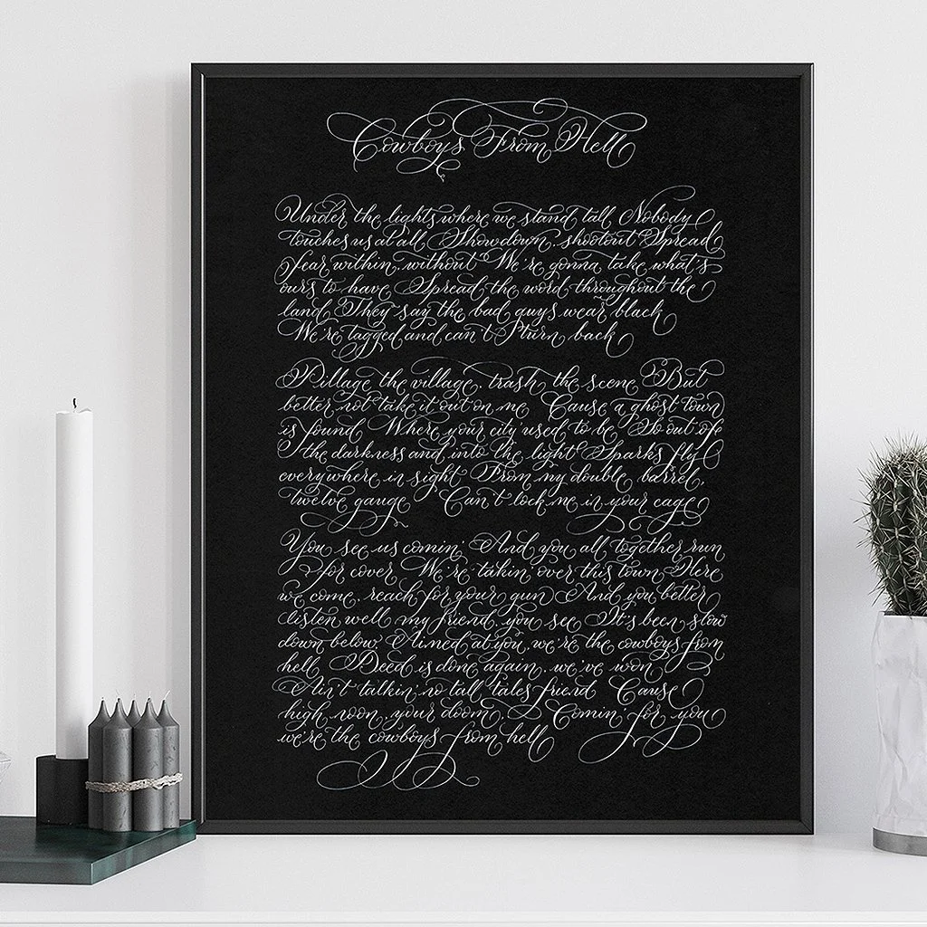 Song lyrics in calligraphy on black paper