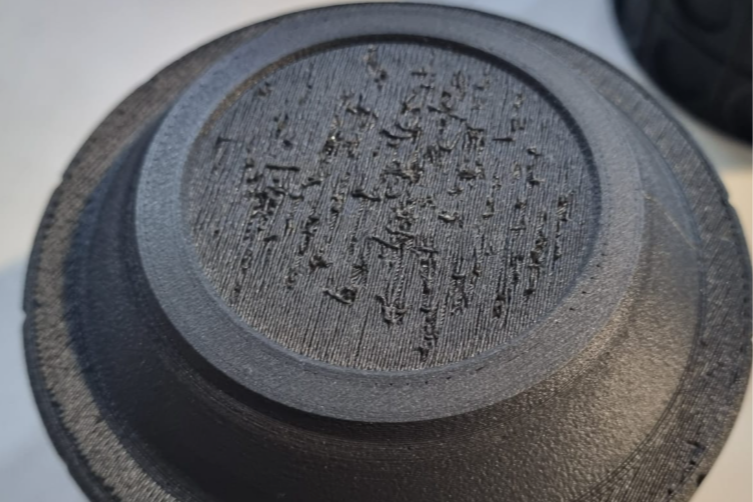Poor surface finish on an FDM 3D printed part after support removal, showing rough texture and scarring.