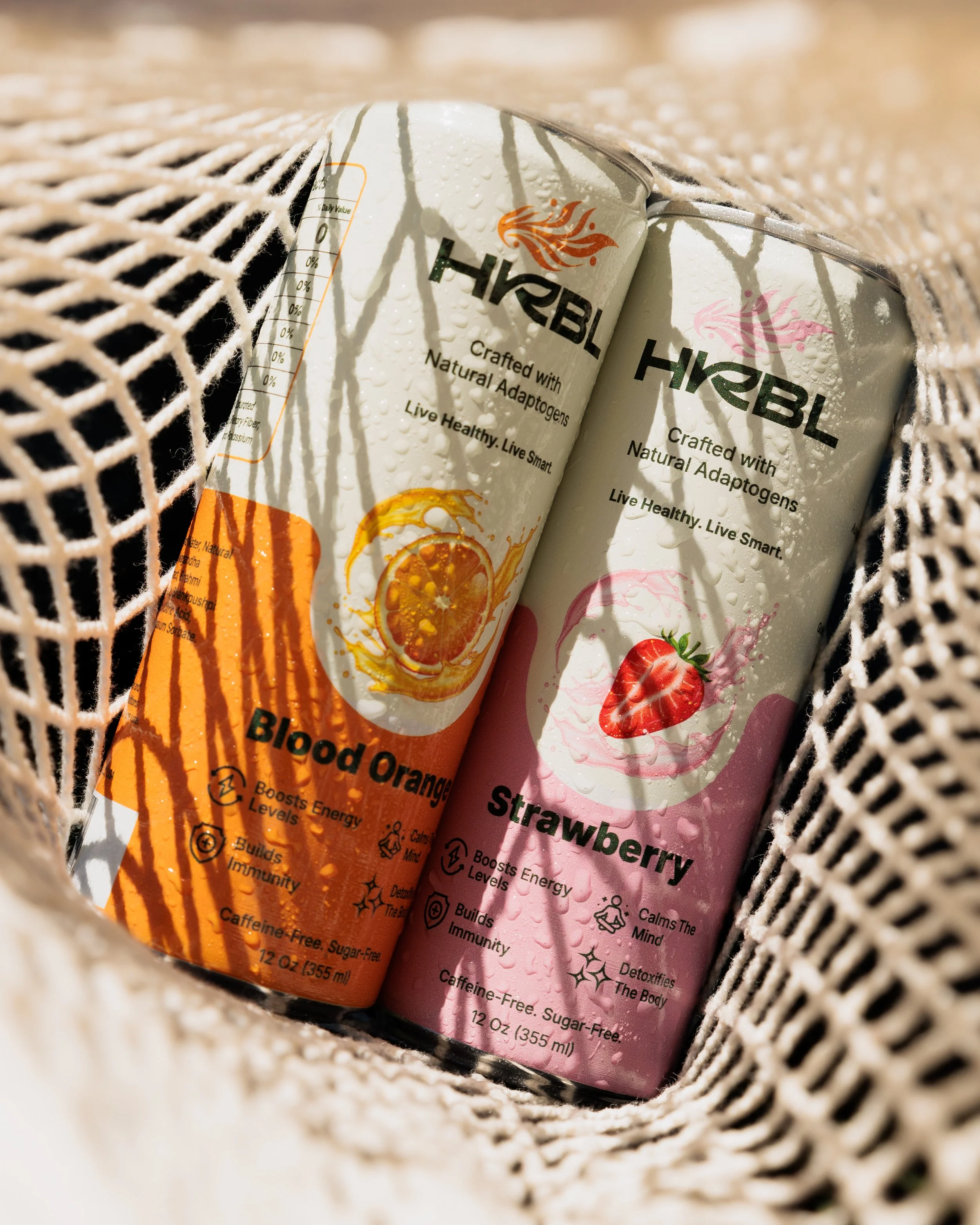 HRBL sparkling water lifestyle photography in woven bag by Los Angeles beverage photographer Matt Francisco